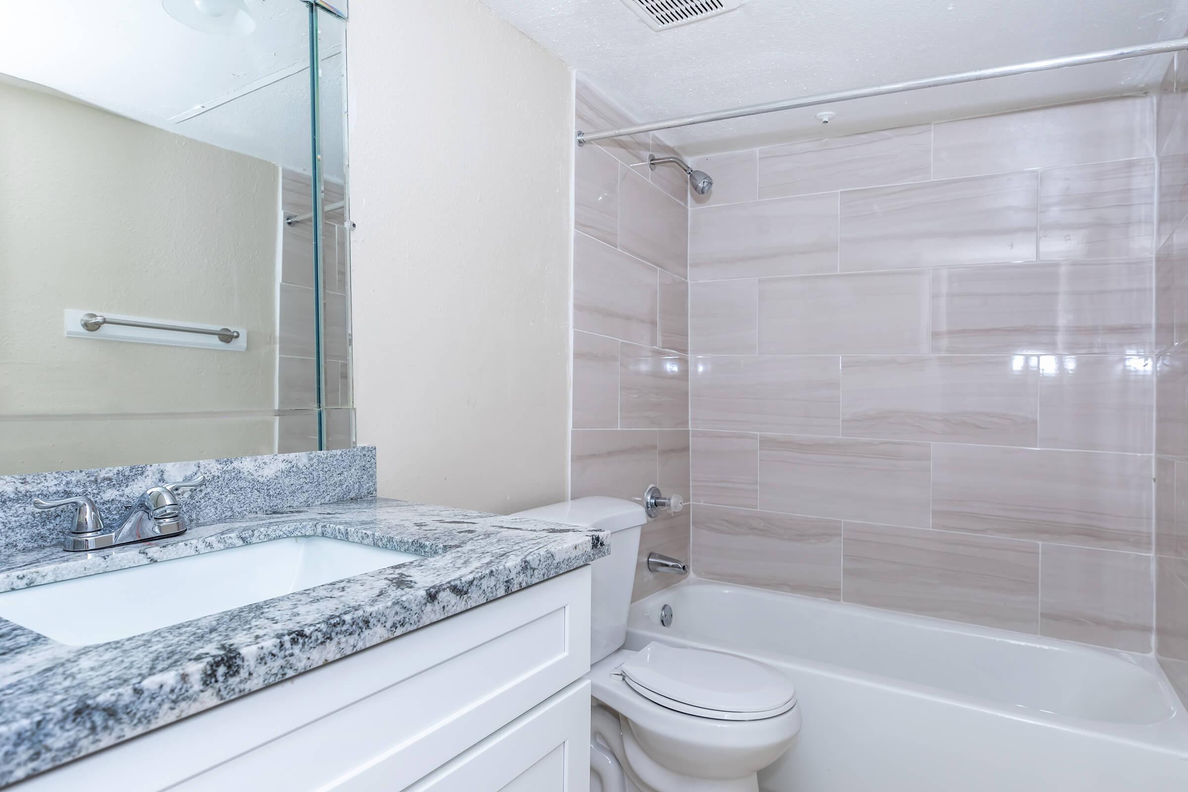 a room with a sink and a bath tub