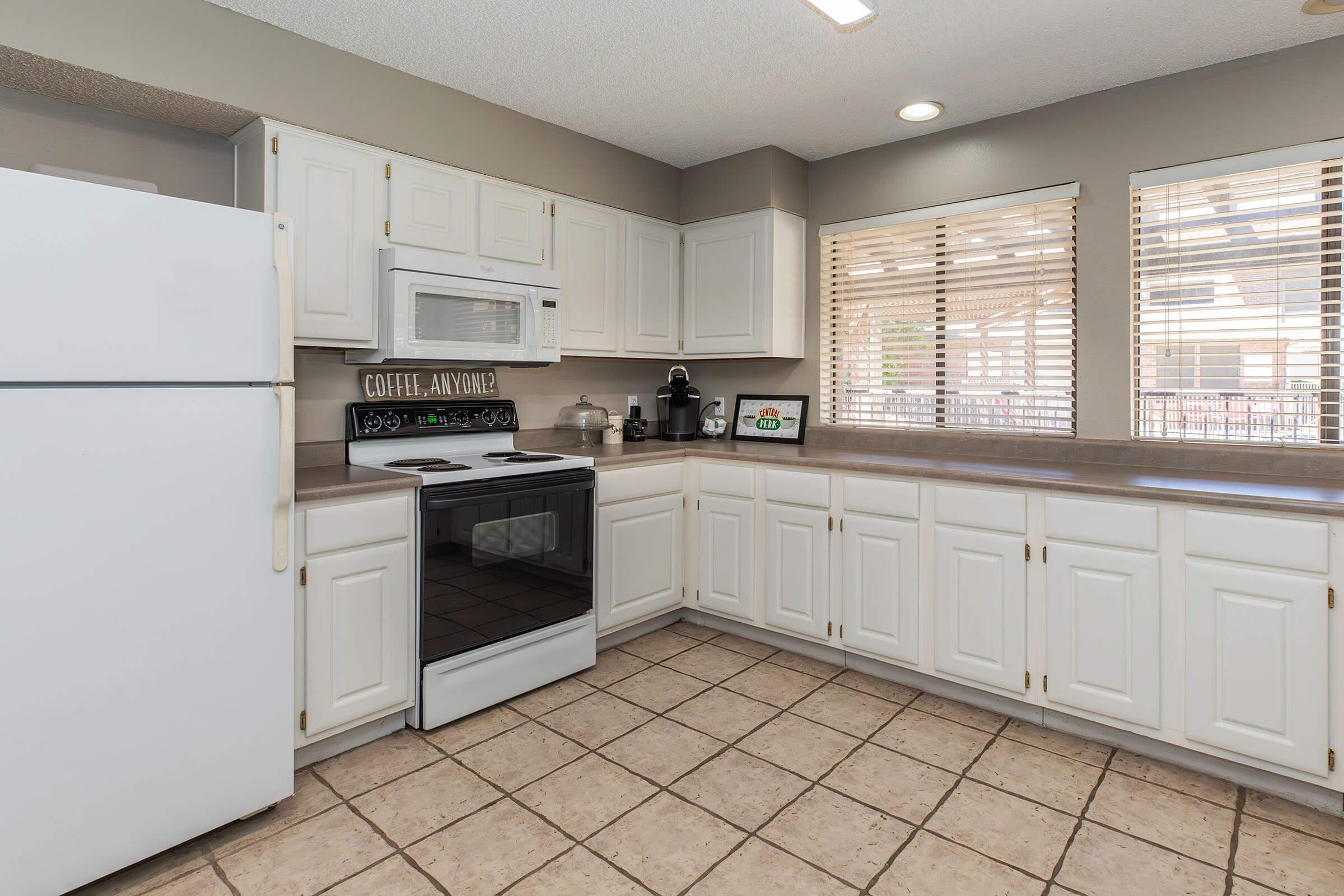 a kitchen with a tile floor