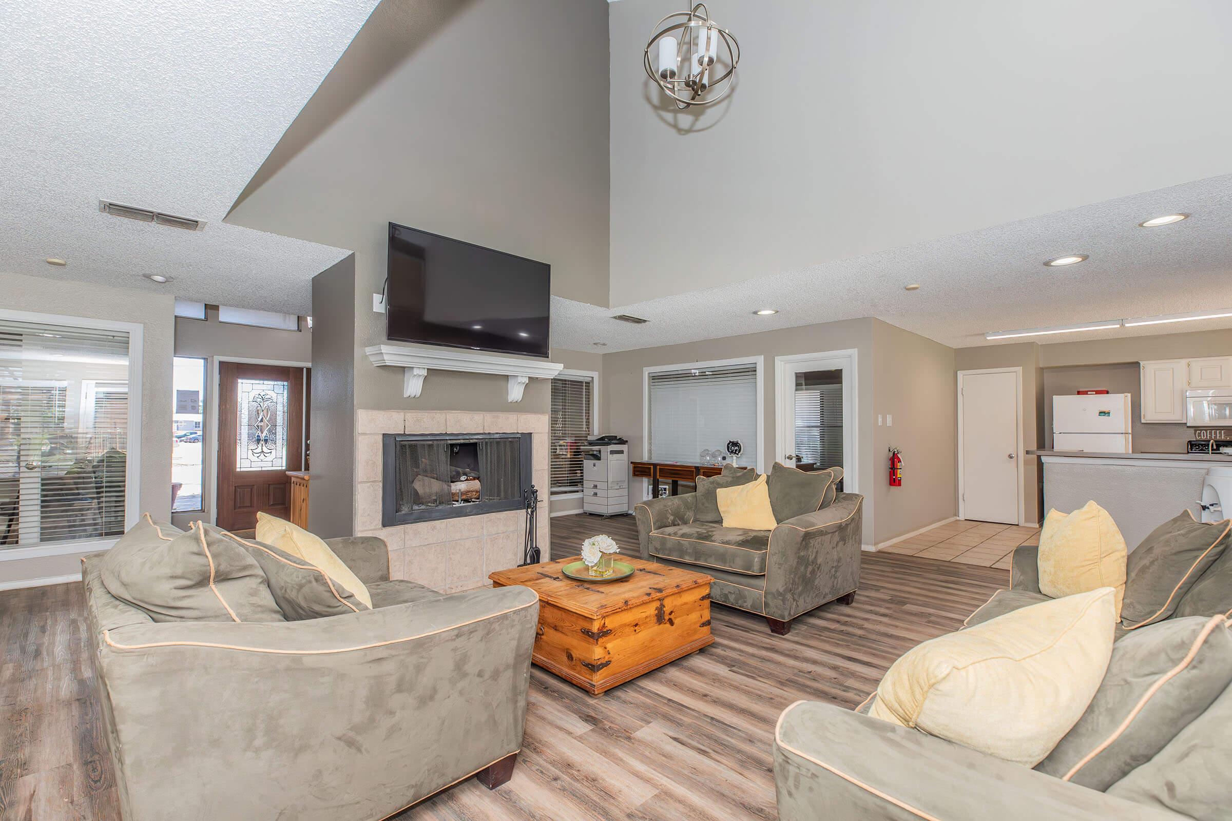 a living room filled with furniture and a fireplace