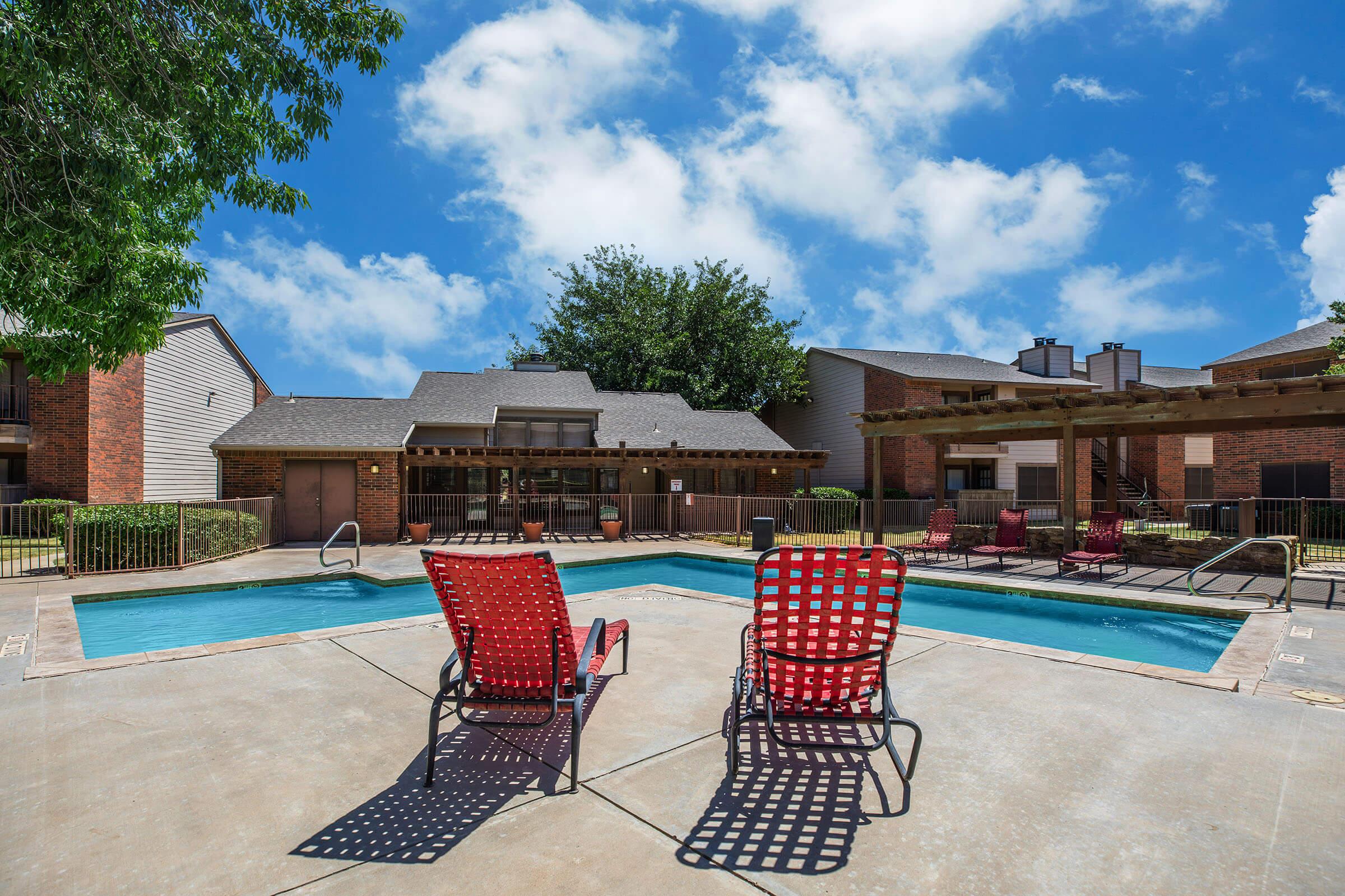 a chair sitting in front of a pool