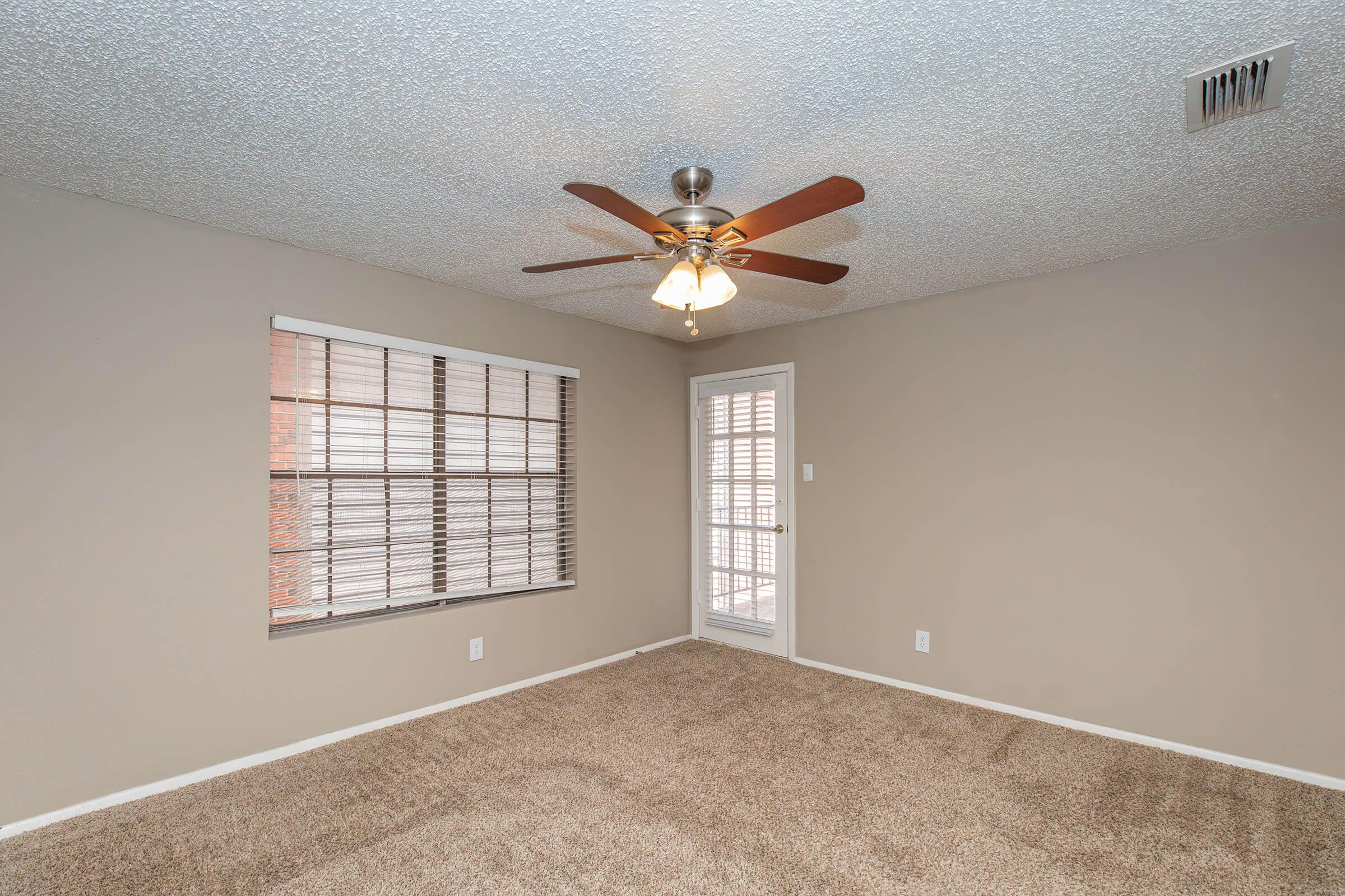 a bedroom with a large window