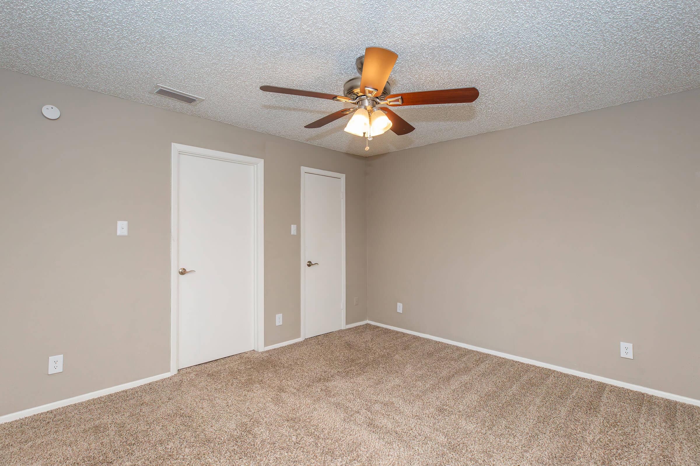 a bedroom with a large mirror