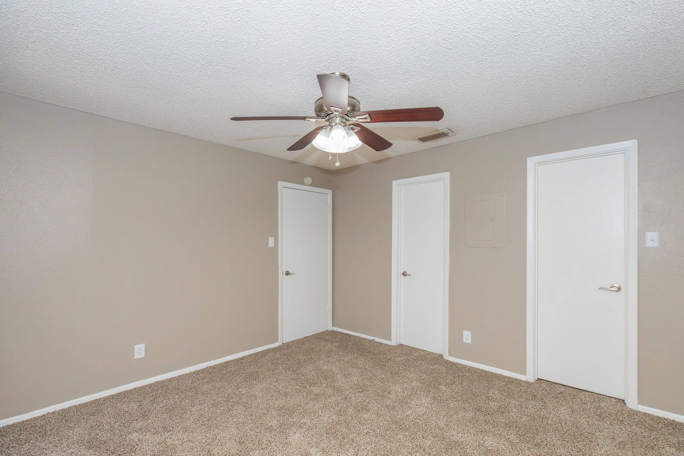 a bedroom with a large mirror