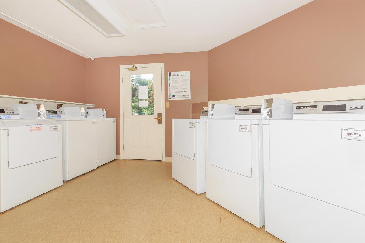 a large white refrigerator in a kitchen