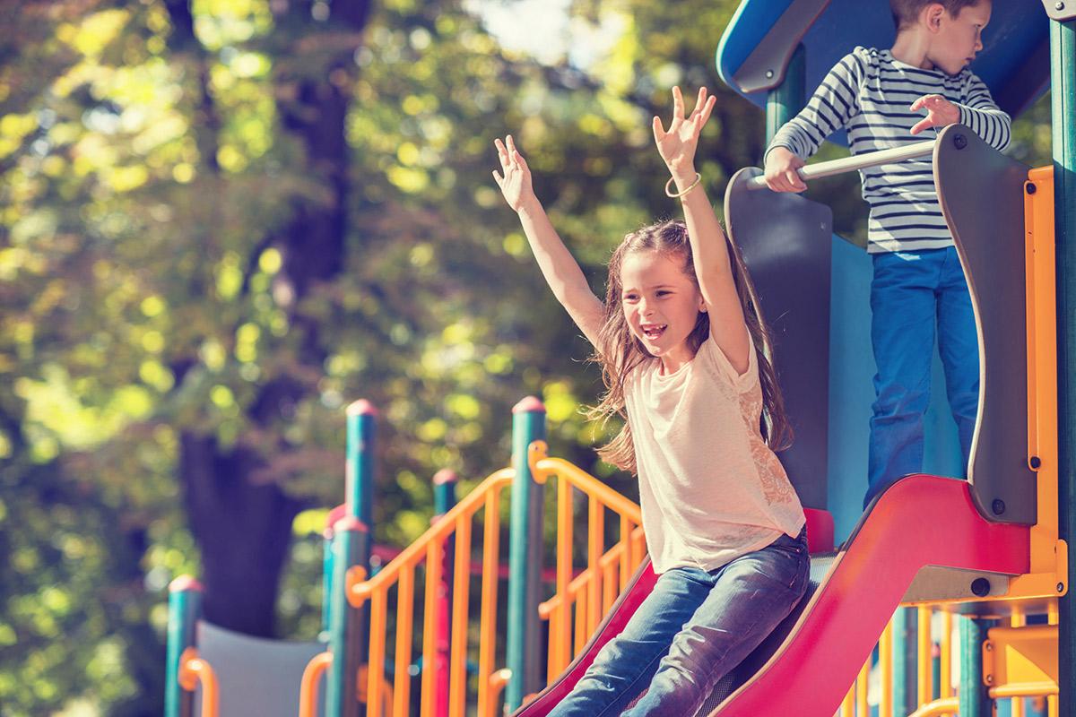 a person riding on the back of a playground