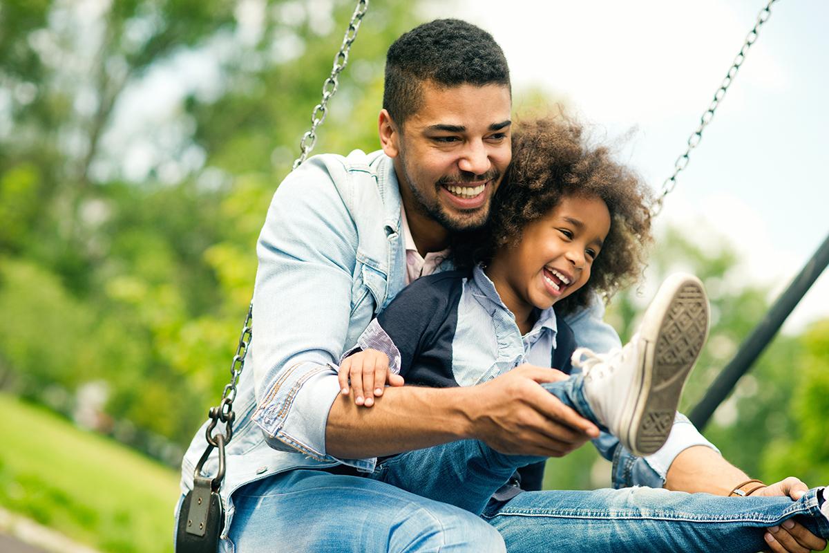 a man sitting on a swing