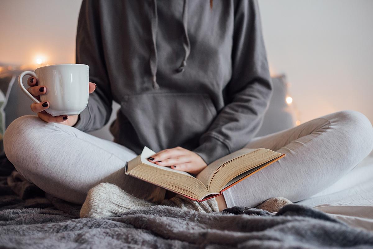 a person sitting on a bed