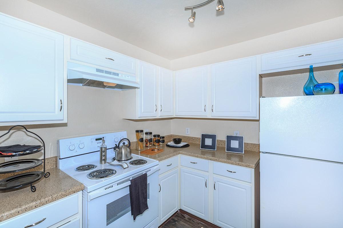 a kitchen with a stove a sink and a microwave