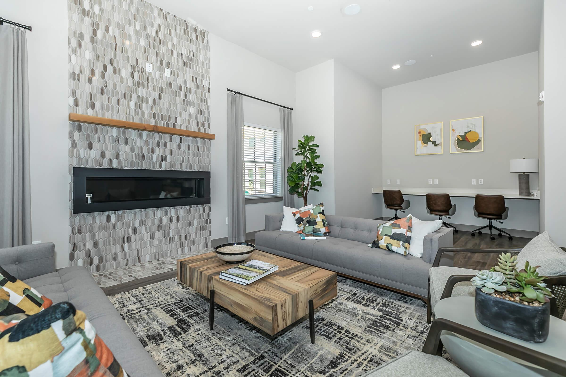 a living room filled with furniture and a flat screen tv