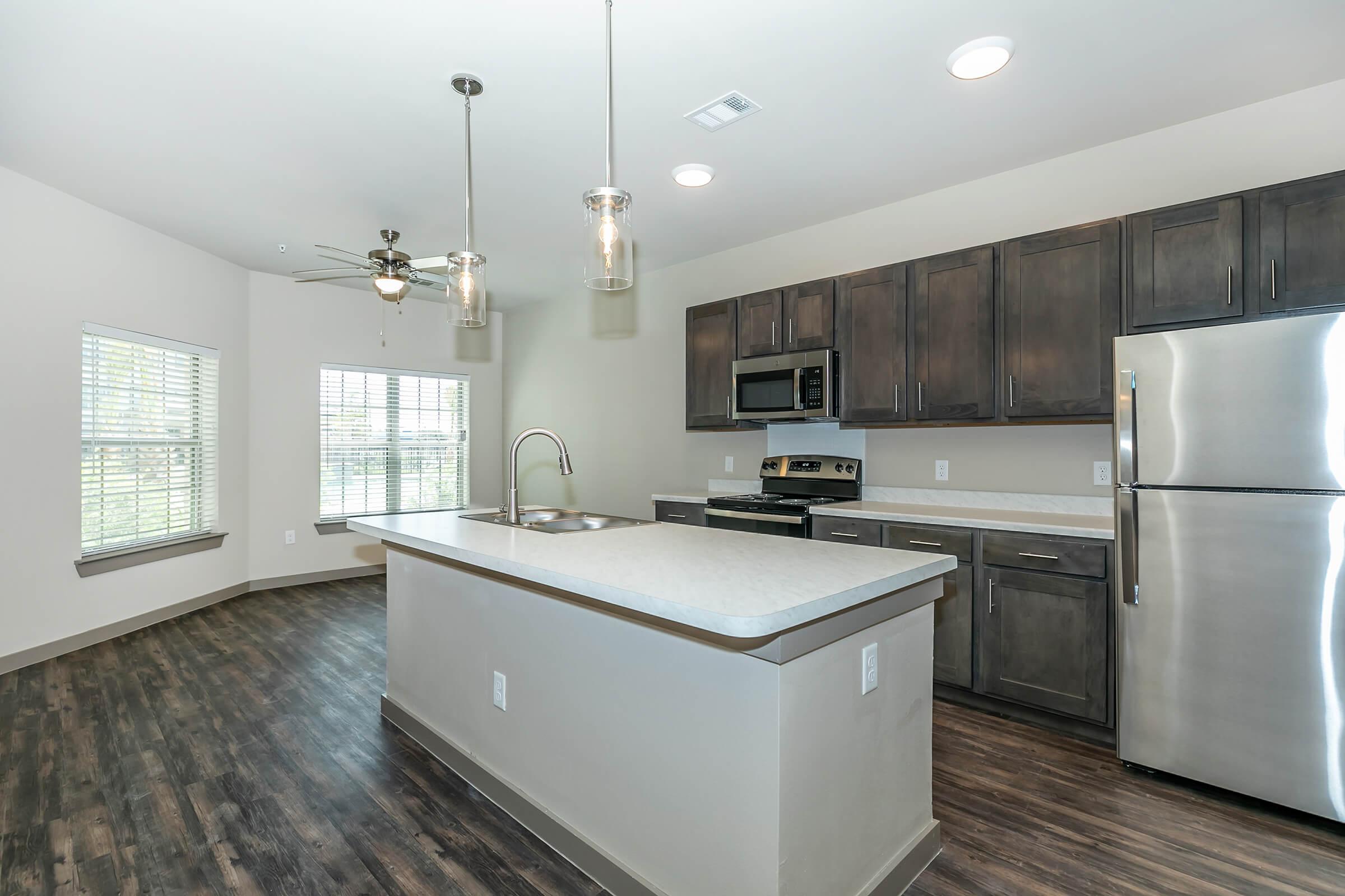 a large kitchen with stainless steel appliances