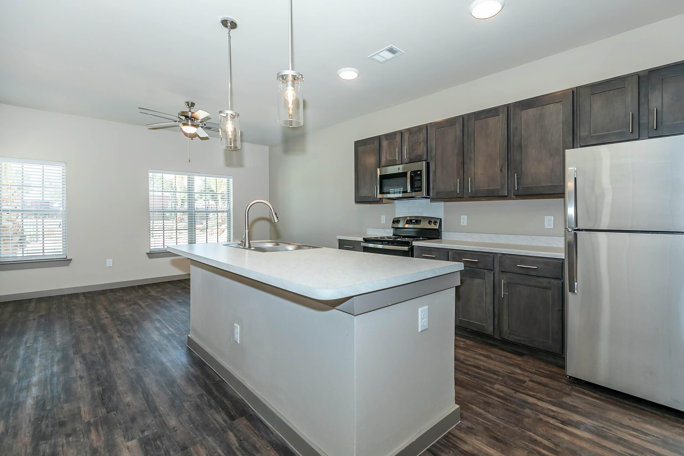 a large kitchen with stainless steel appliances