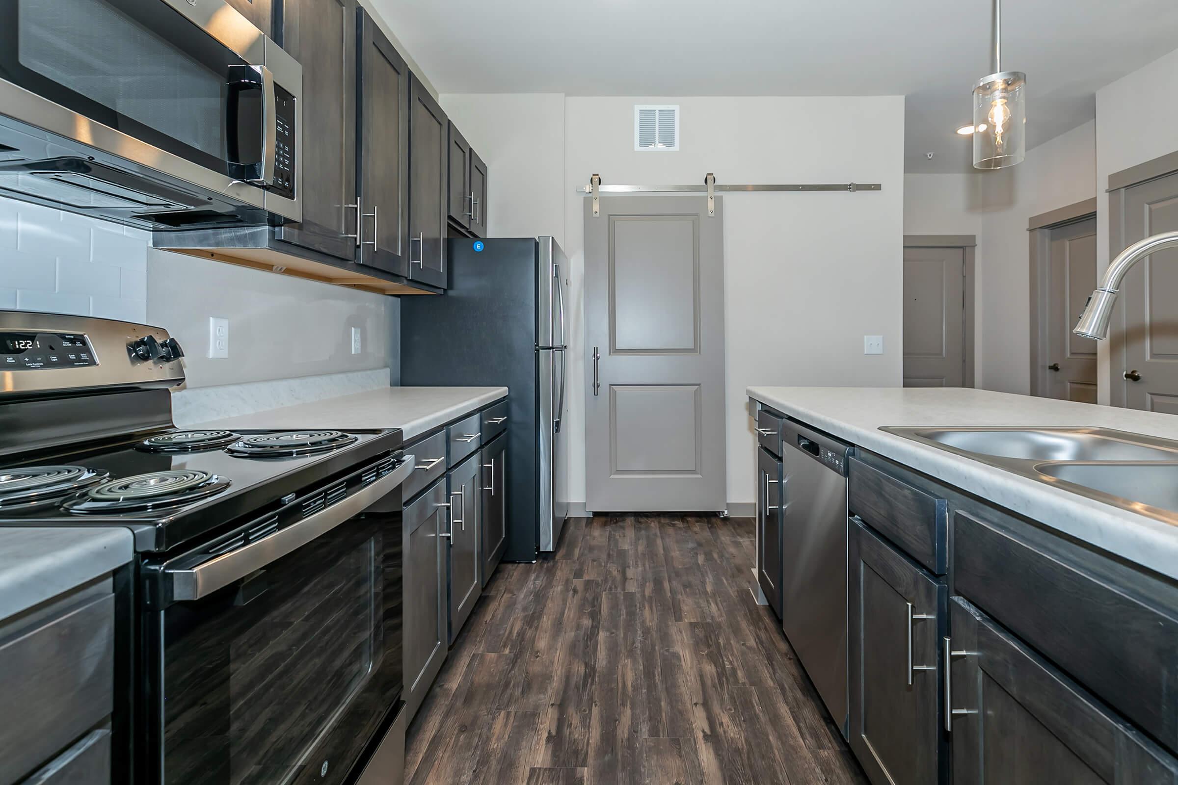 a large kitchen with stainless steel appliances