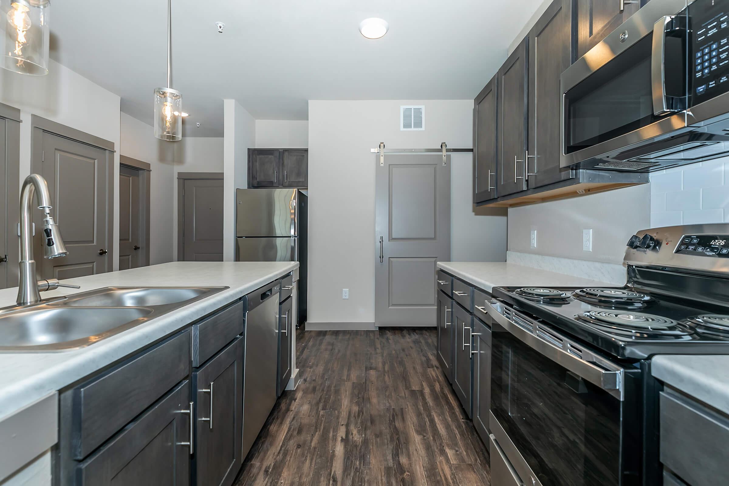 a large kitchen with stainless steel appliances