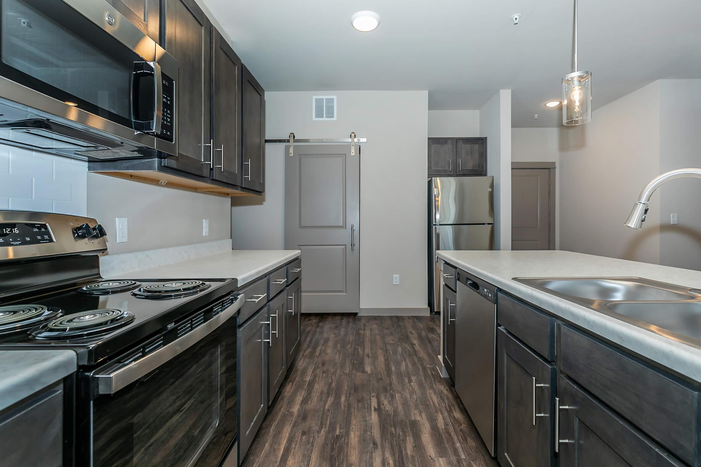 a kitchen with a stove top oven