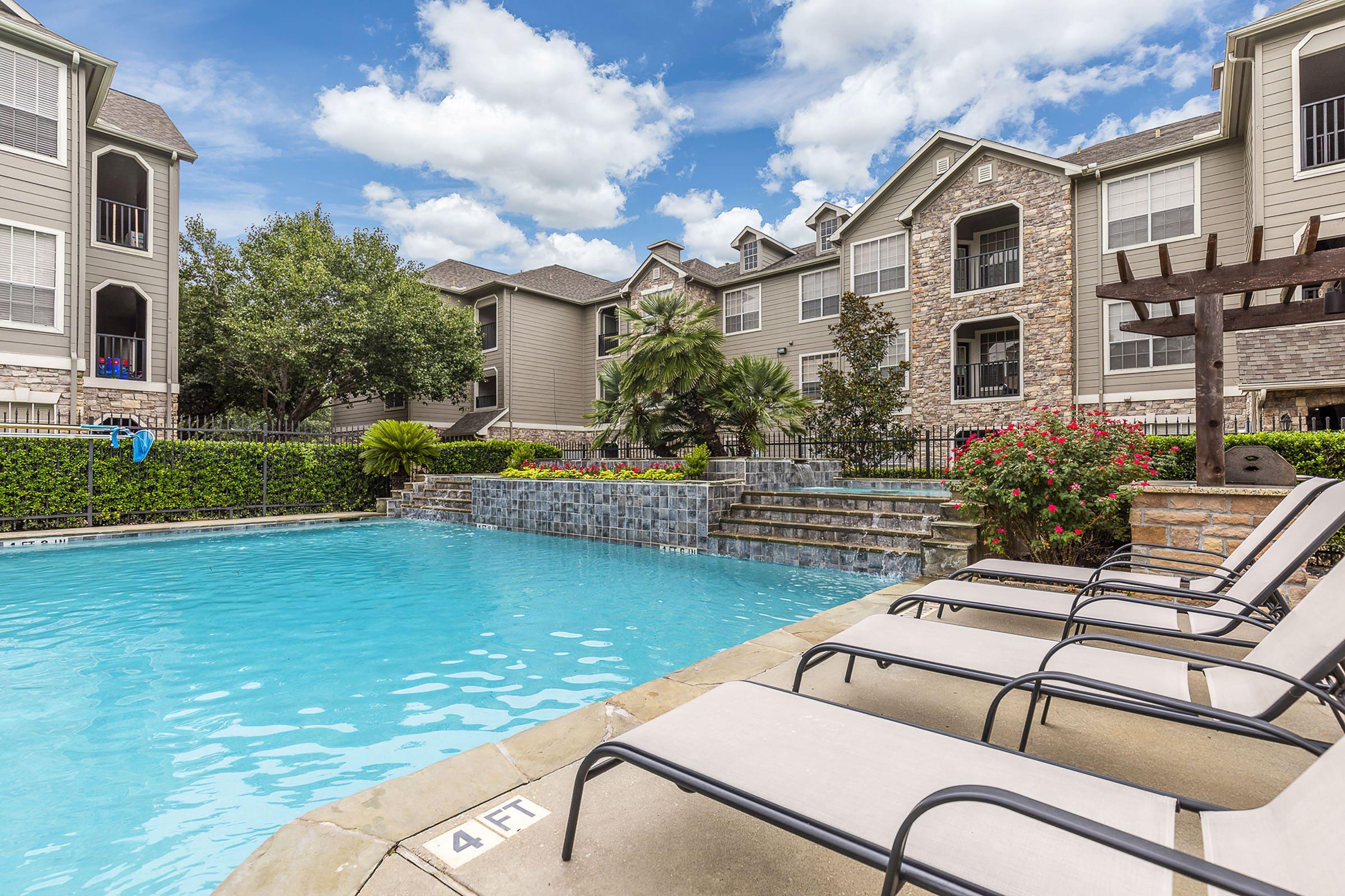 a large pool of water in front of a building