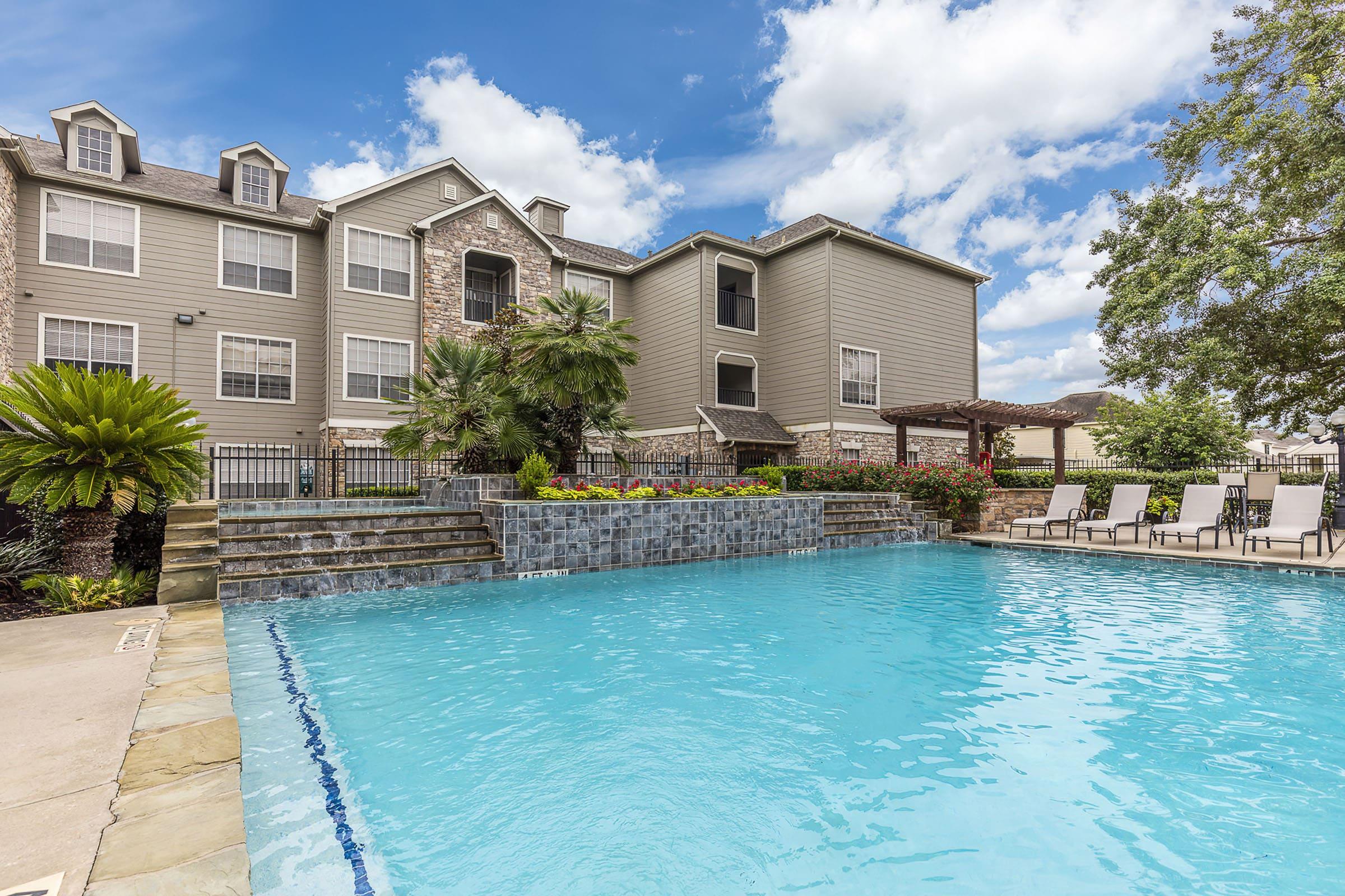 a large pool of water in front of a building