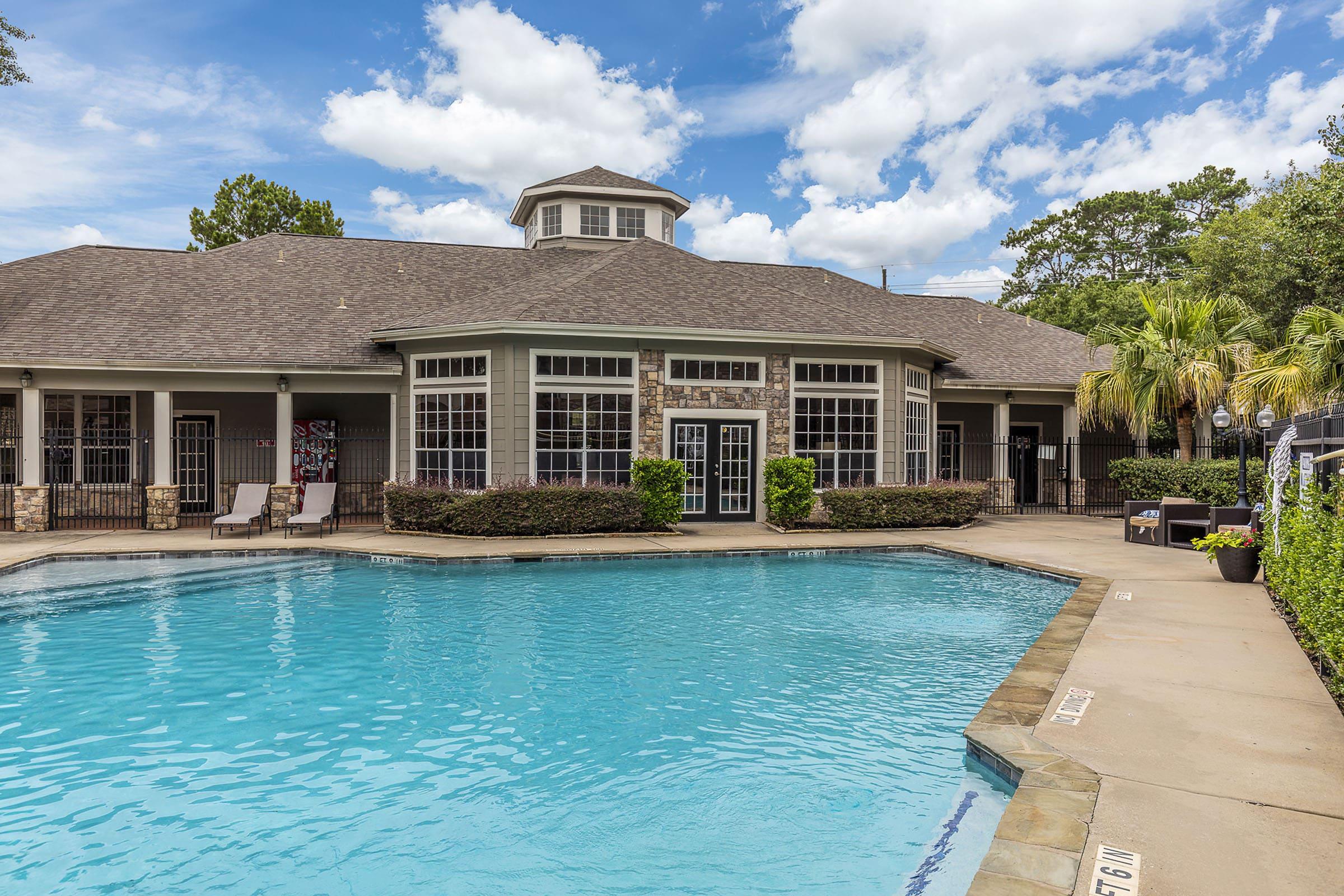 a large pool of water in front of a house