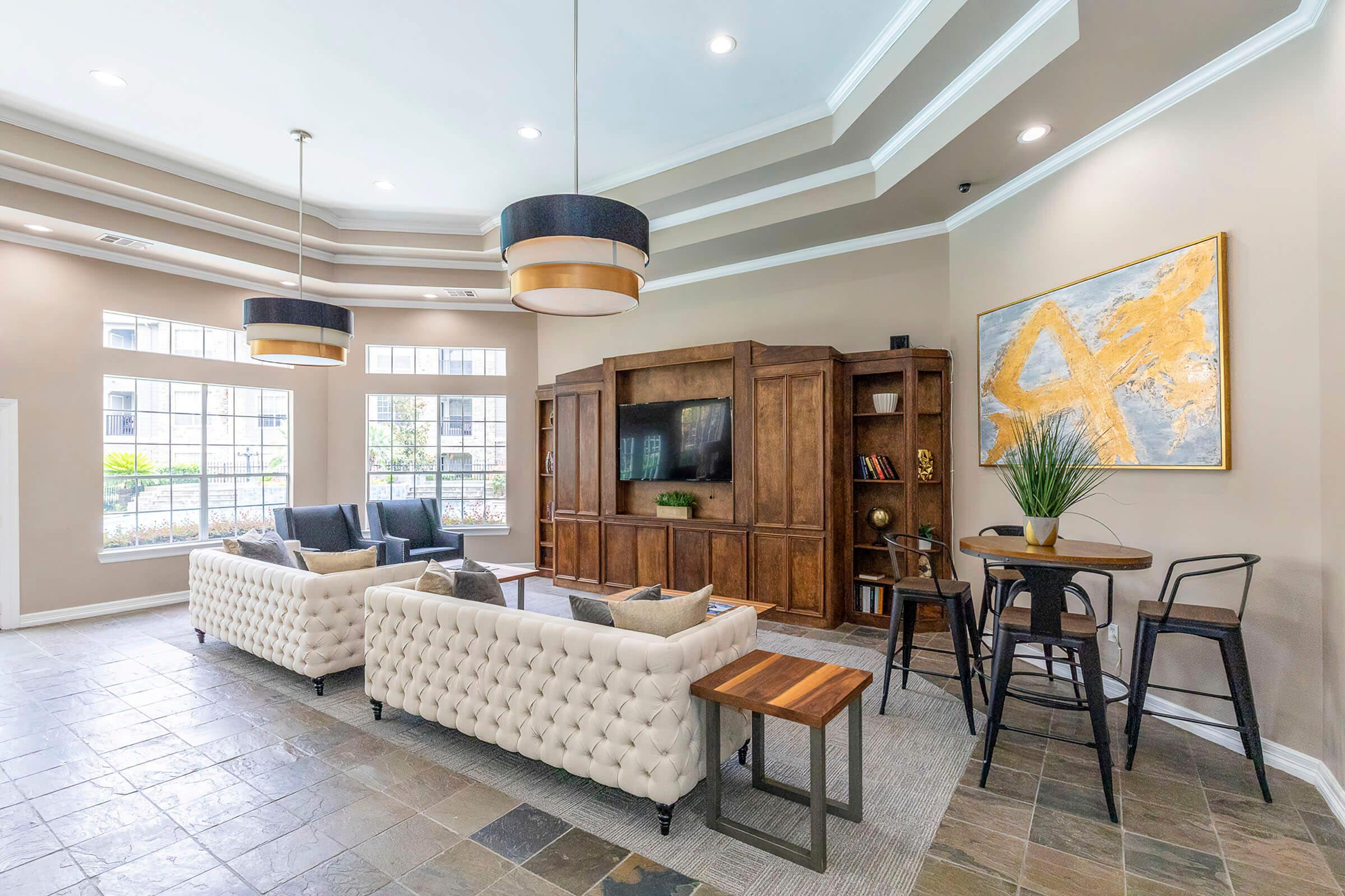 a living room filled with furniture and a fireplace