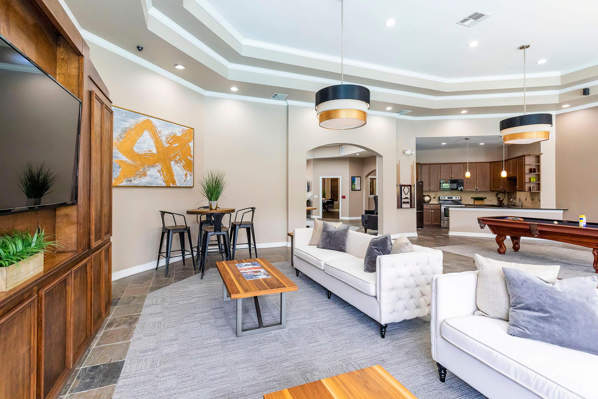 a living room filled with furniture and a bed