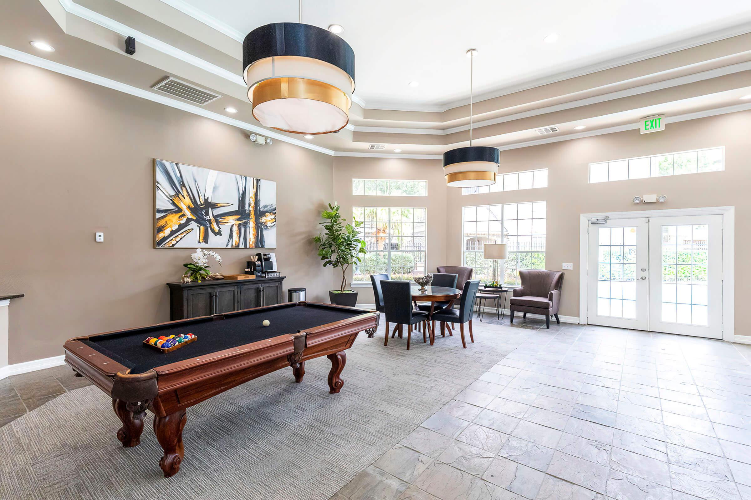 a living room filled with furniture and a table