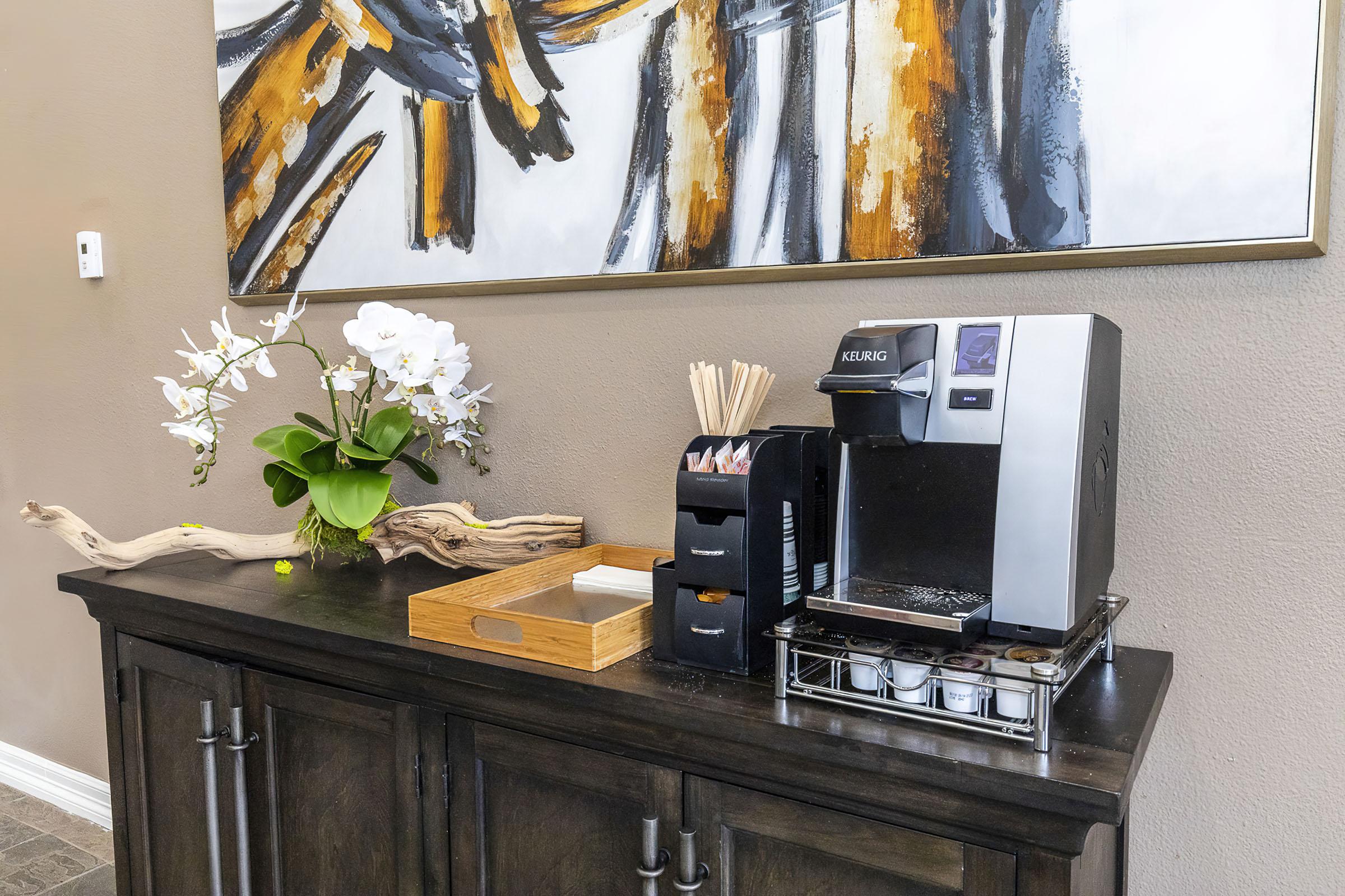 a vase of flowers on a kitchen counter