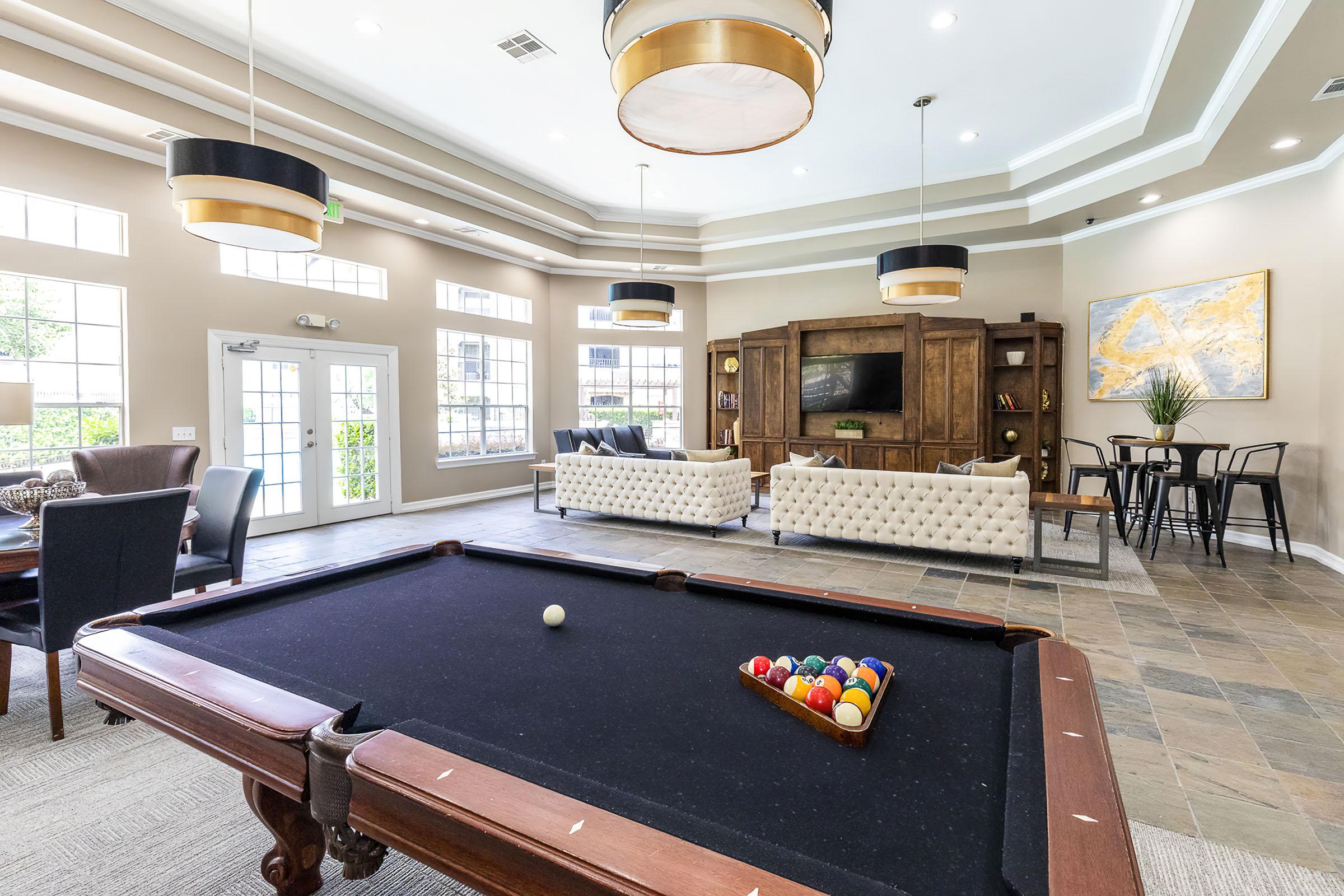 a living room filled with furniture and a large window