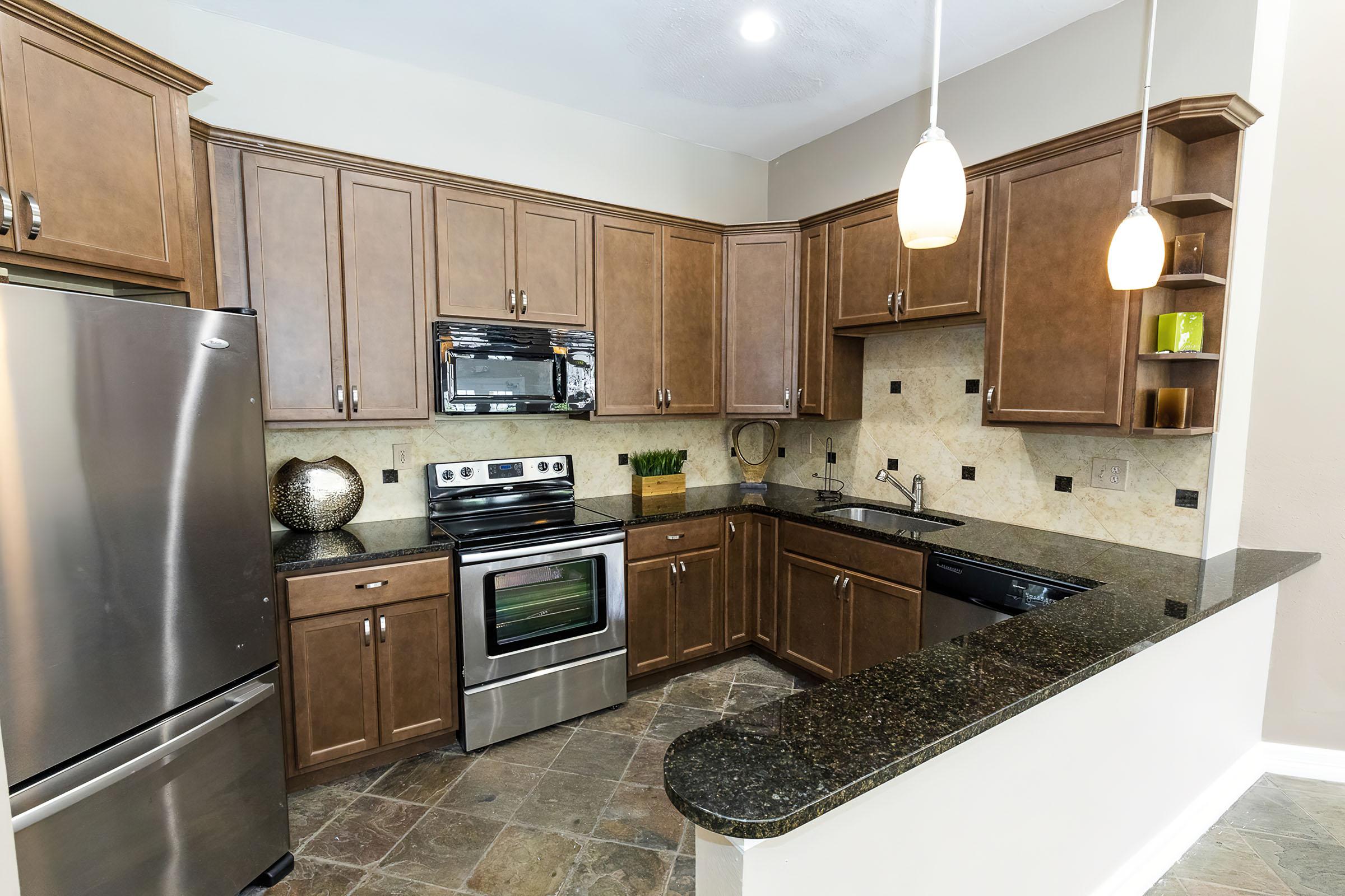 a modern kitchen with stainless steel appliances