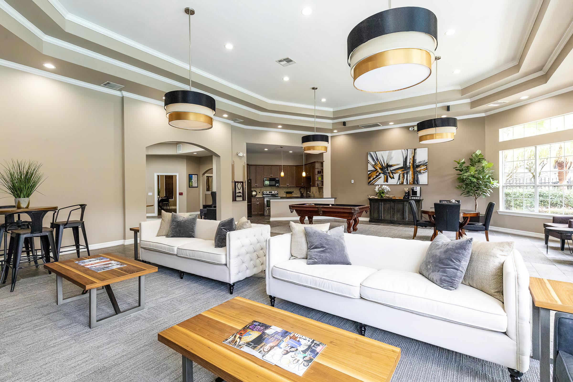 a living room filled with furniture and a table