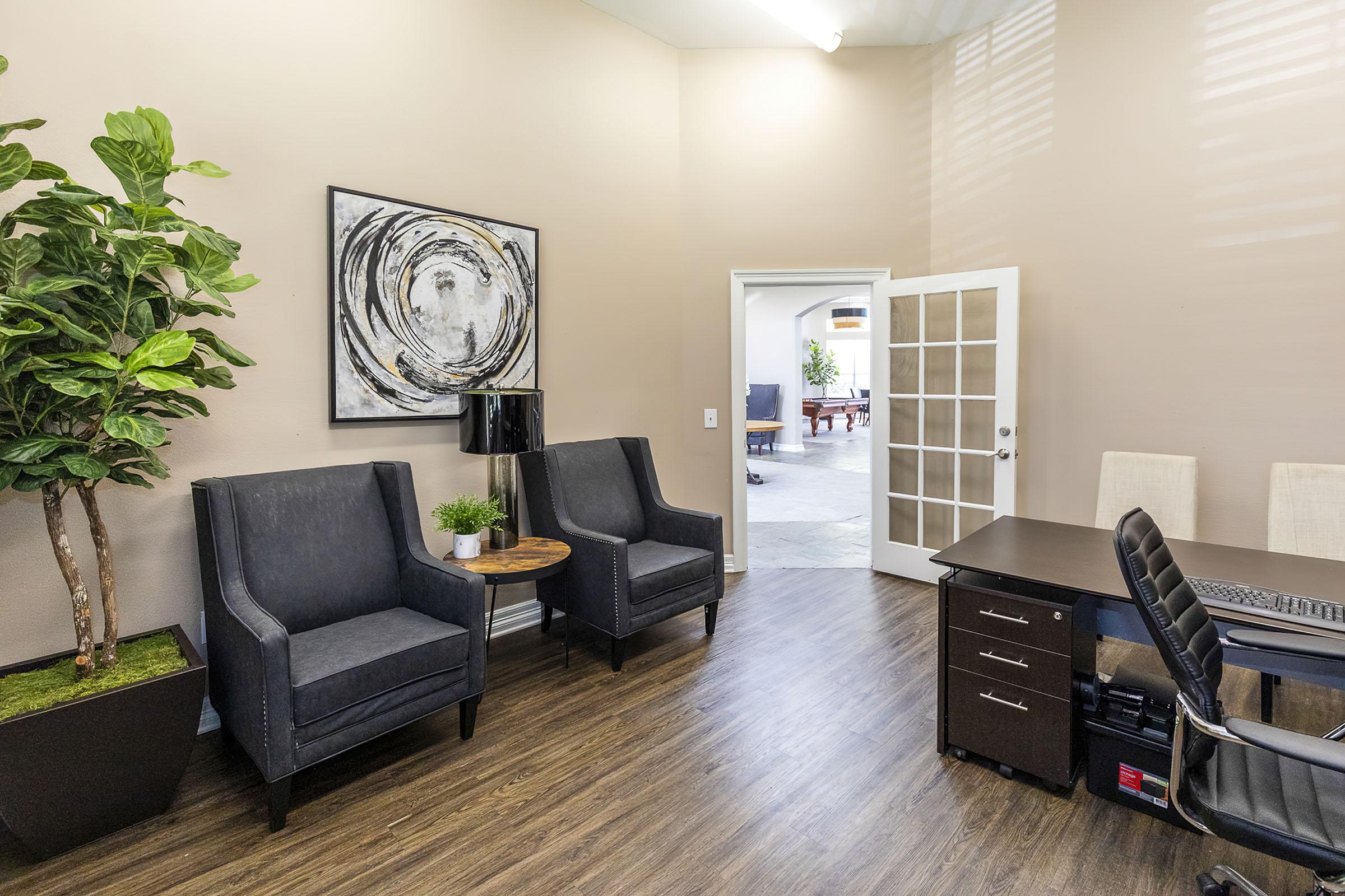 a living room filled with furniture and a tv