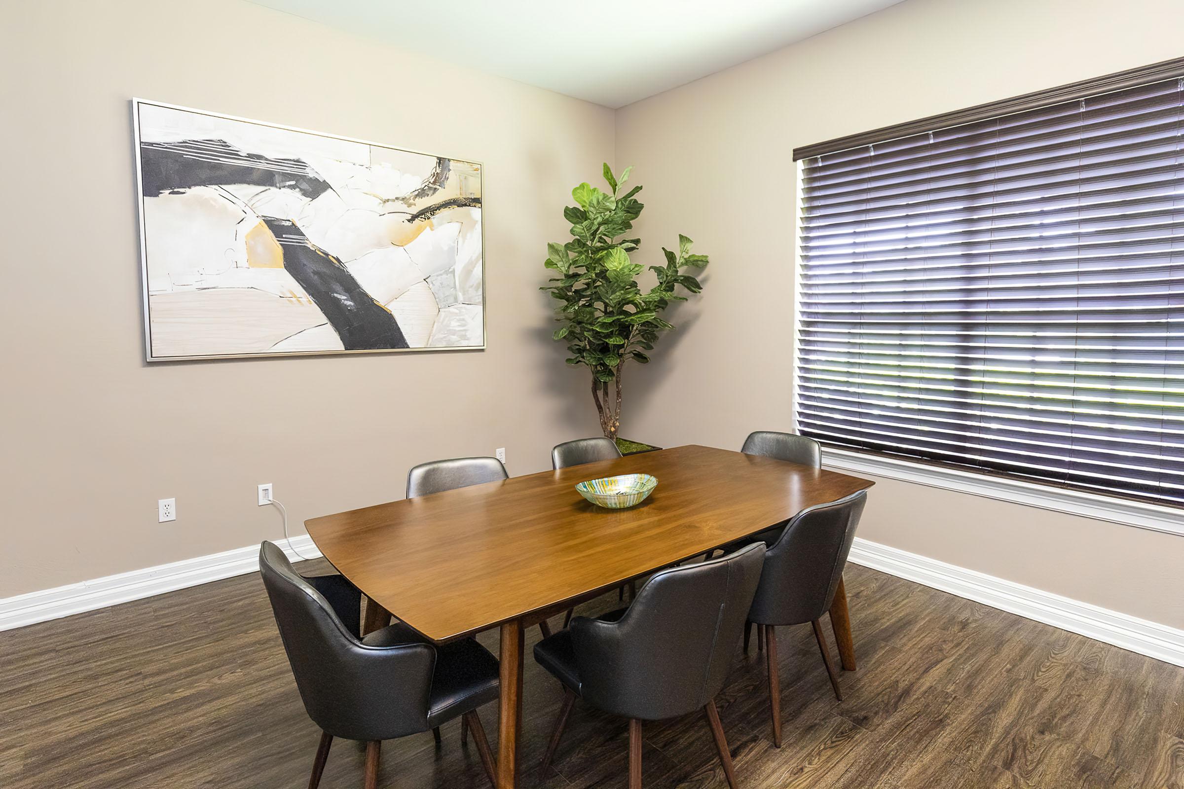 a living room filled with furniture and a large window