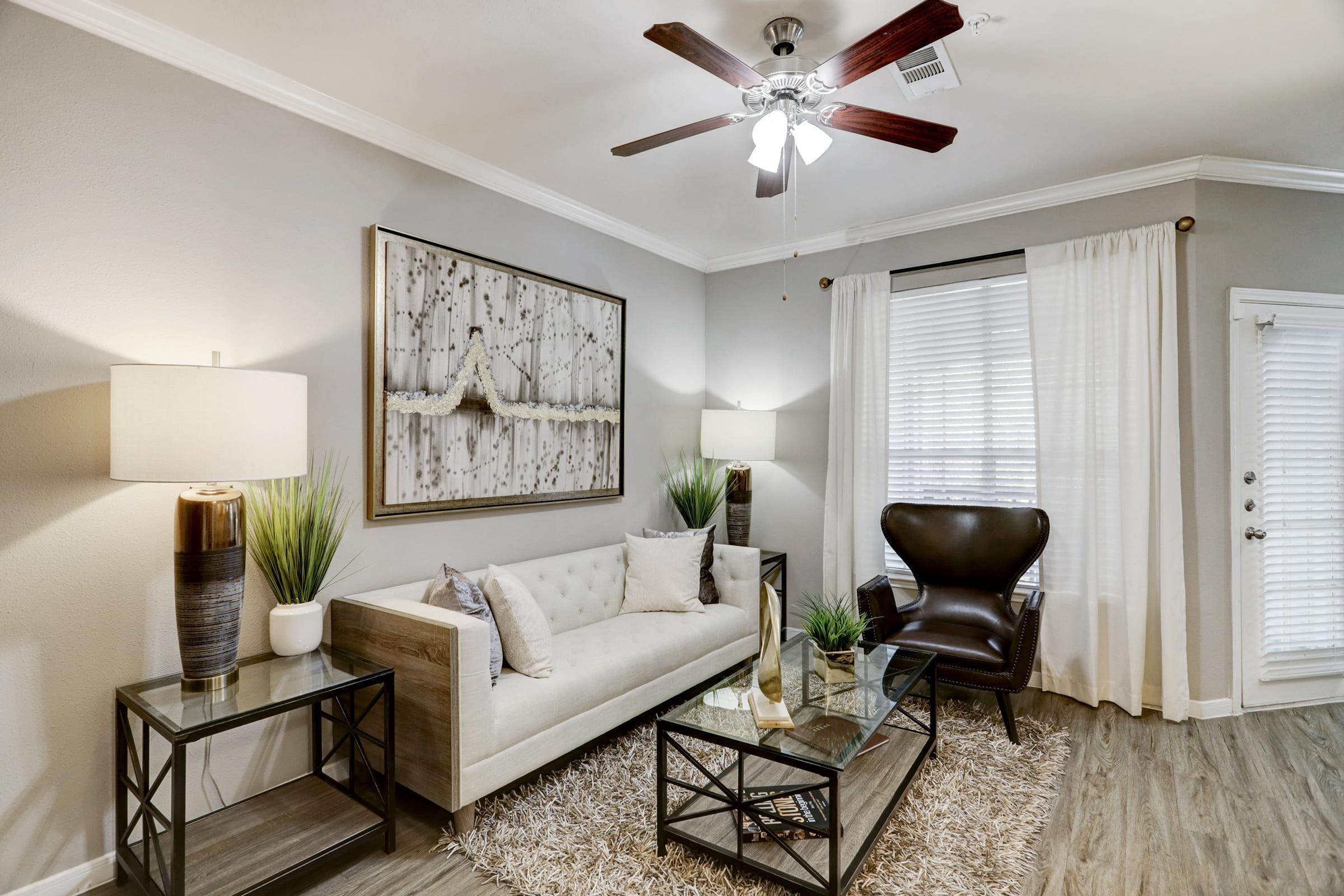 a living room filled with furniture and a fireplace