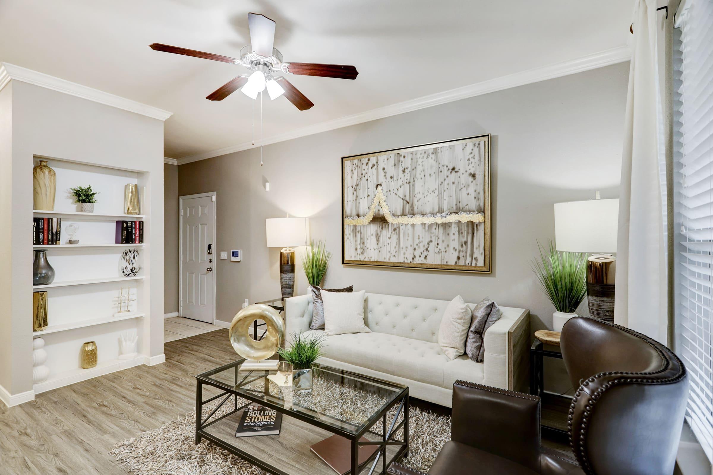 a living room filled with furniture and a fire place