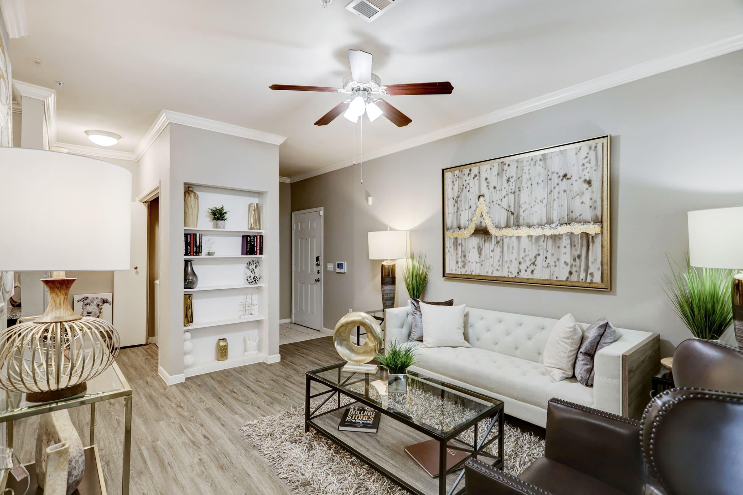 a living room filled with furniture and a fireplace