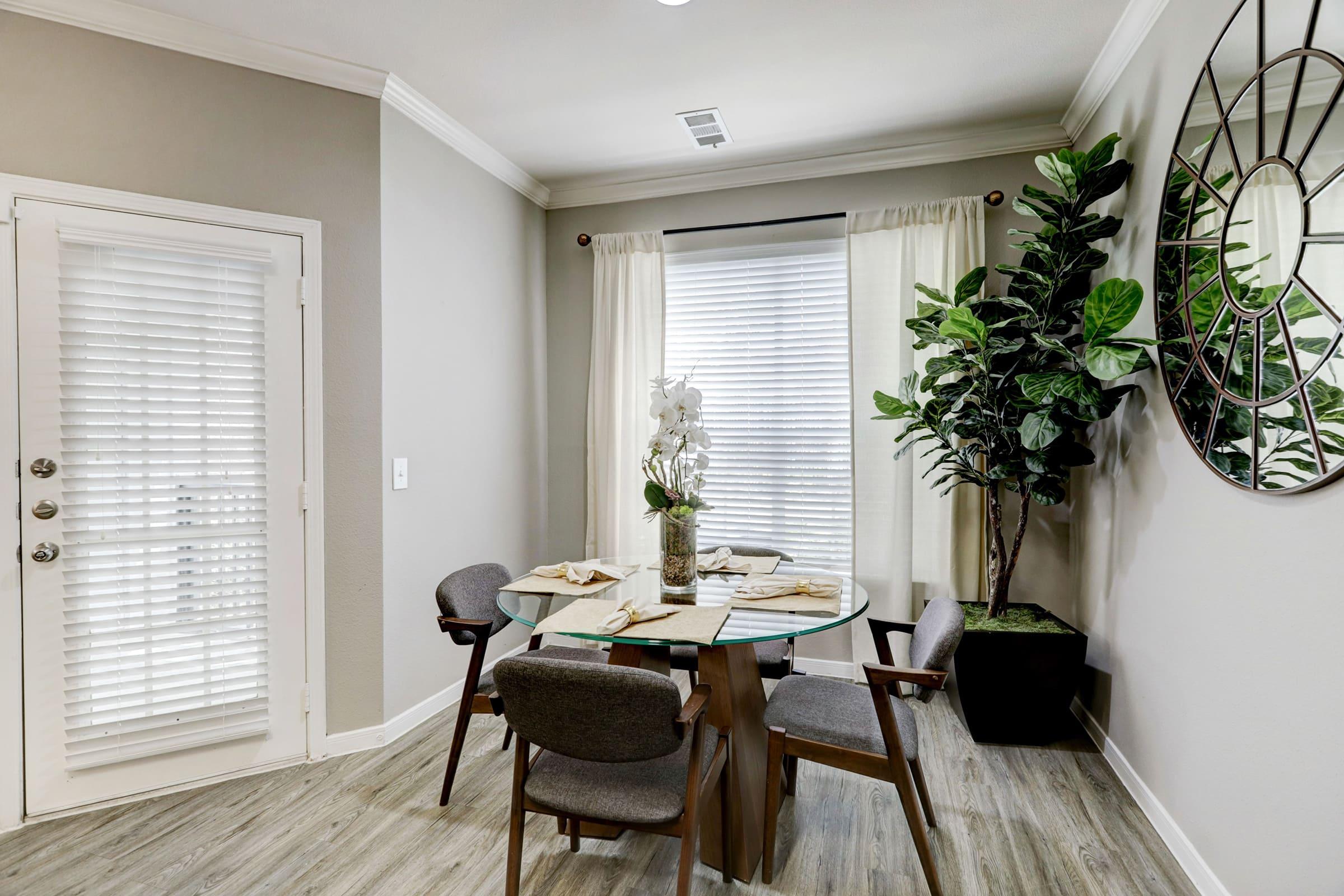 a living room filled with furniture and a large window