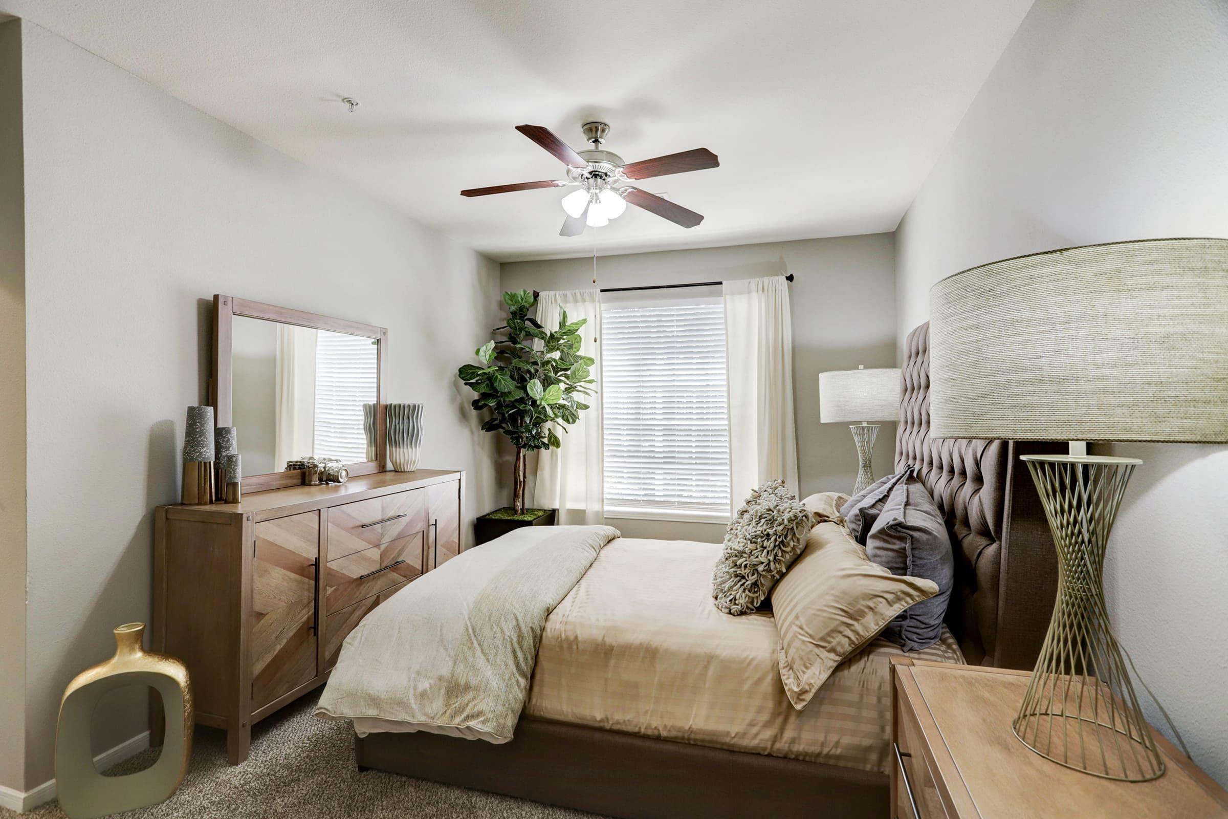 a living room filled with furniture and a large window