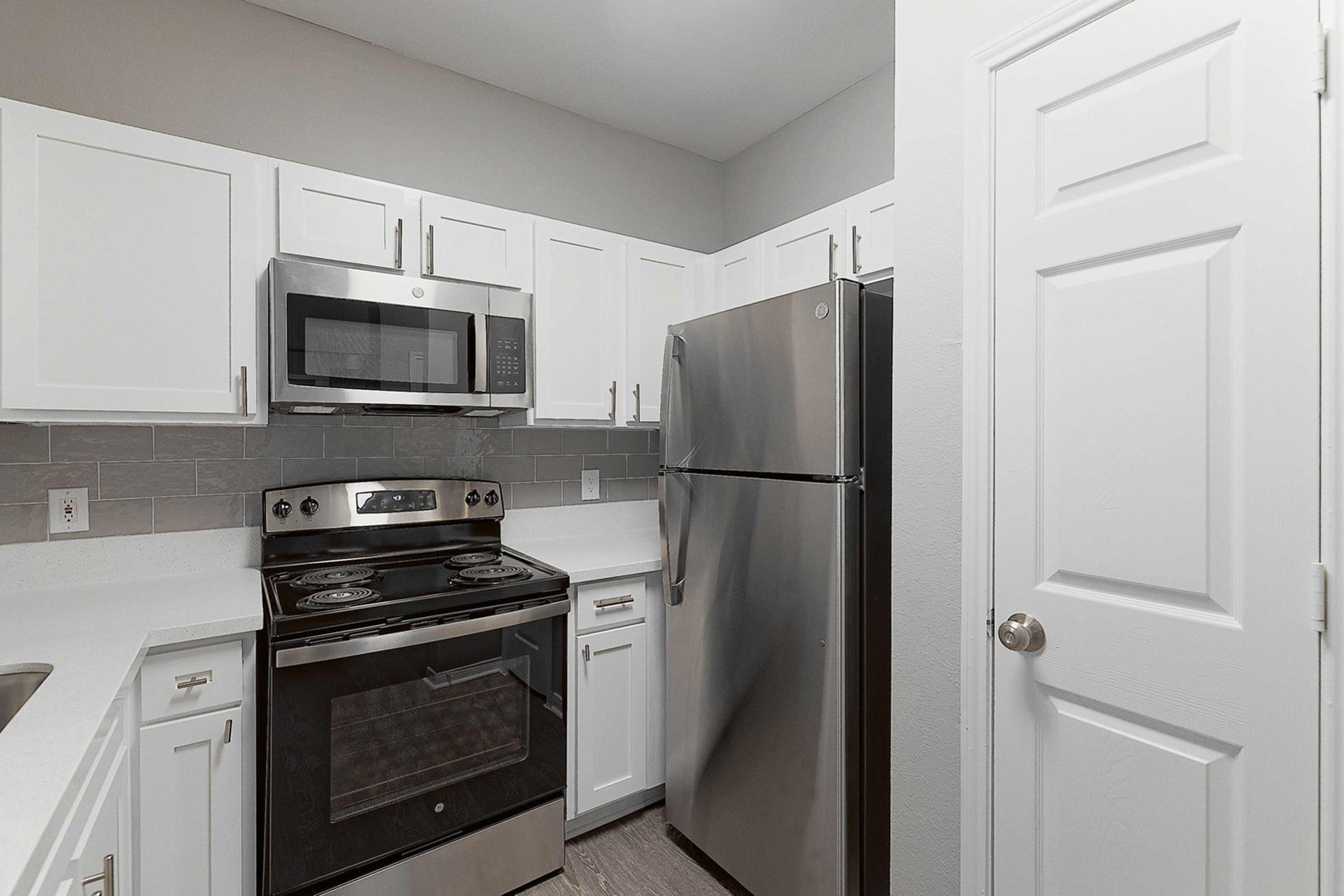 a kitchen with a stove top oven sitting inside of a refrigerator