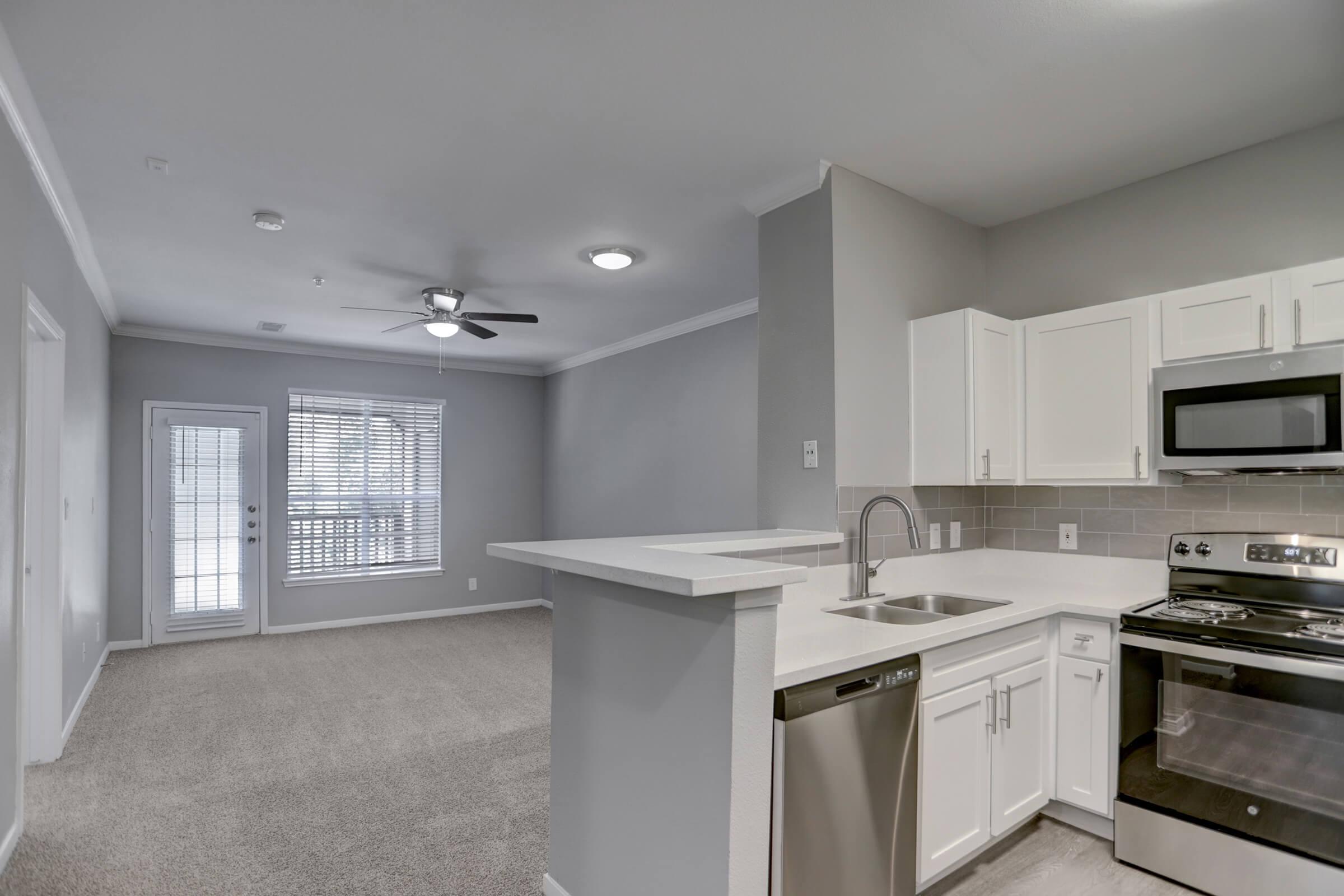 a large kitchen with stainless steel appliances