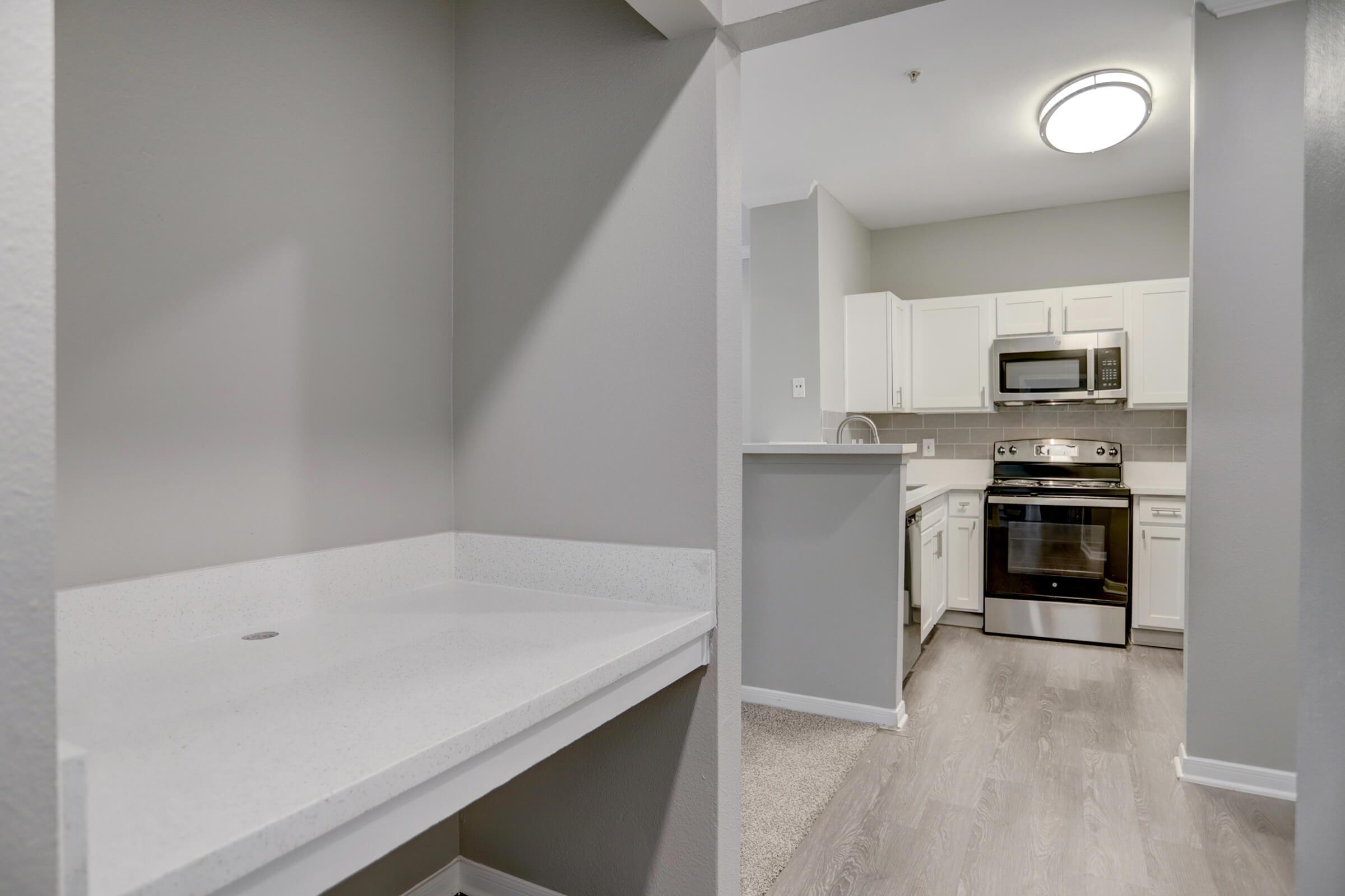 a kitchen with a stove and a microwave