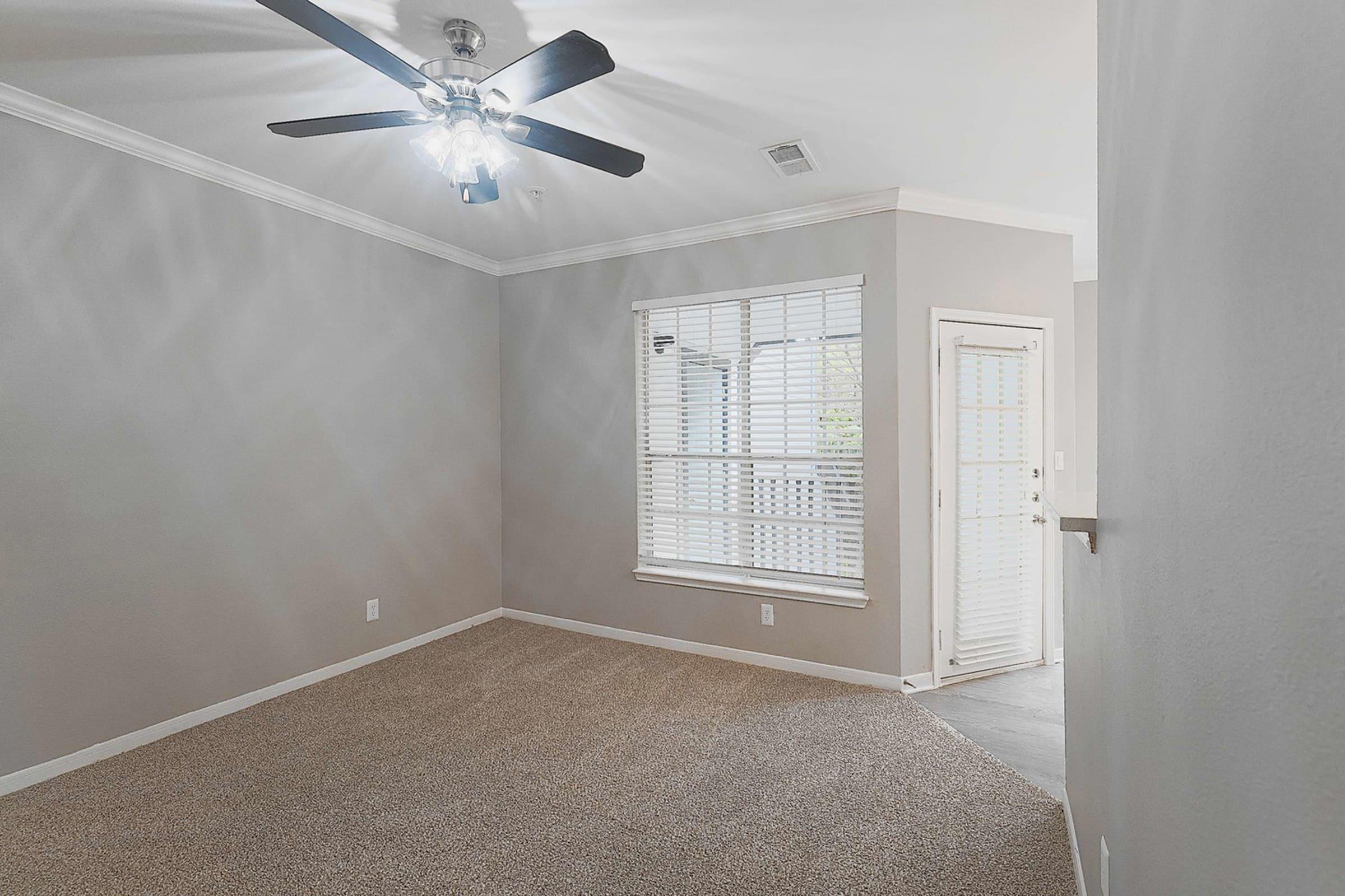 a bedroom with a large window