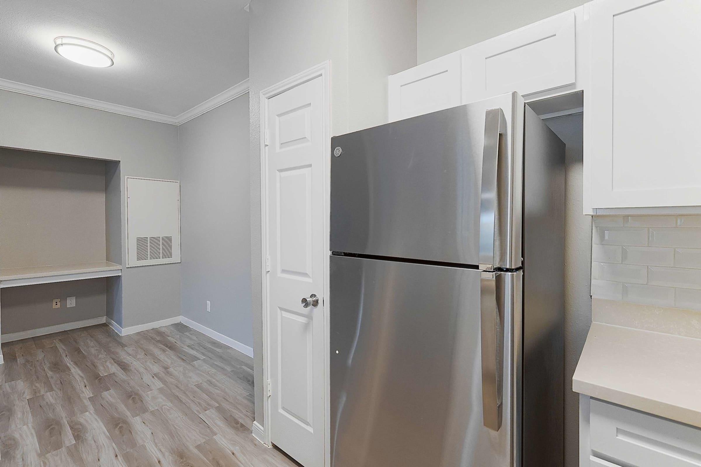 a stainless steel refrigerator in a kitchen