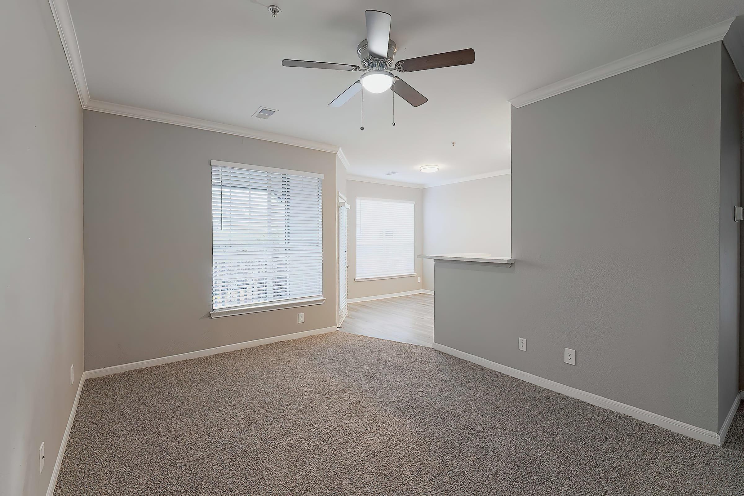 a bedroom with a large window