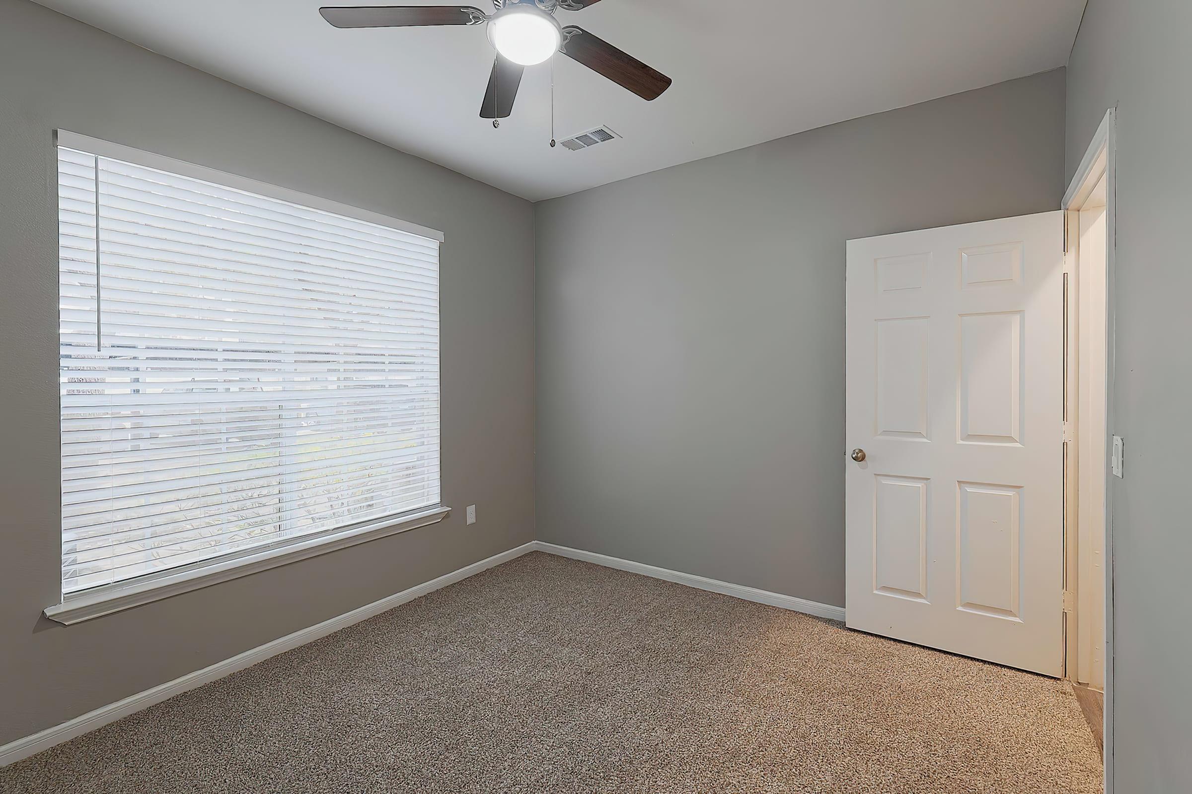 a view of a bedroom next to a window