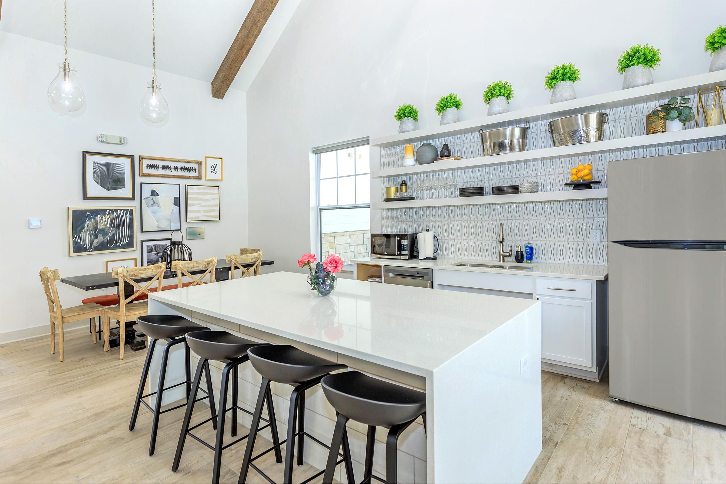 a kitchen with a table in a room