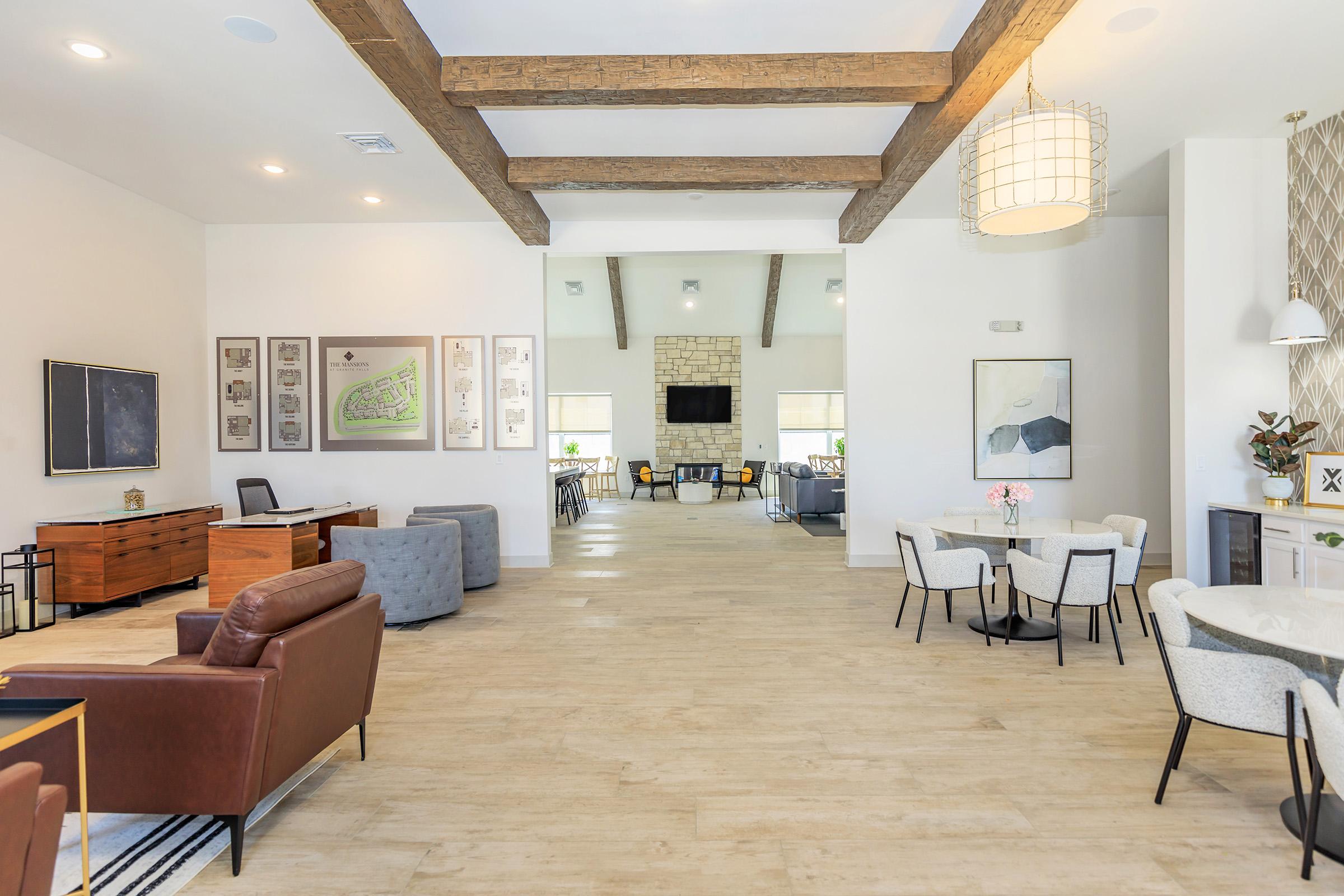 a living room filled with furniture and a fireplace