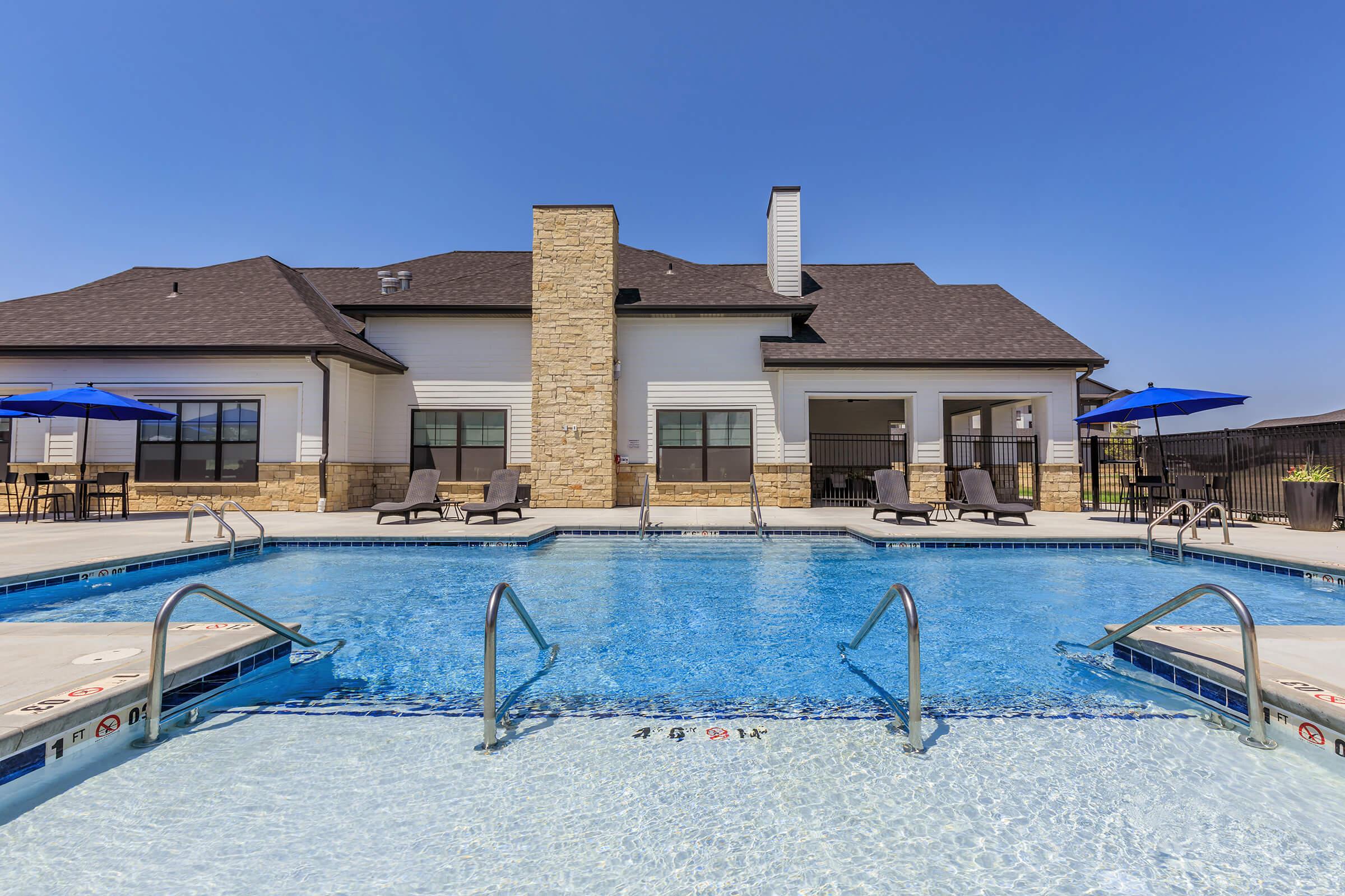 a house with a large pool of water