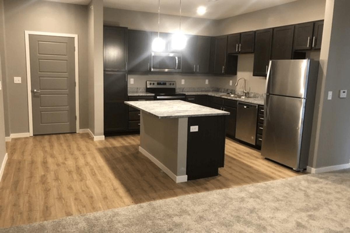 a modern kitchen with stainless steel appliances