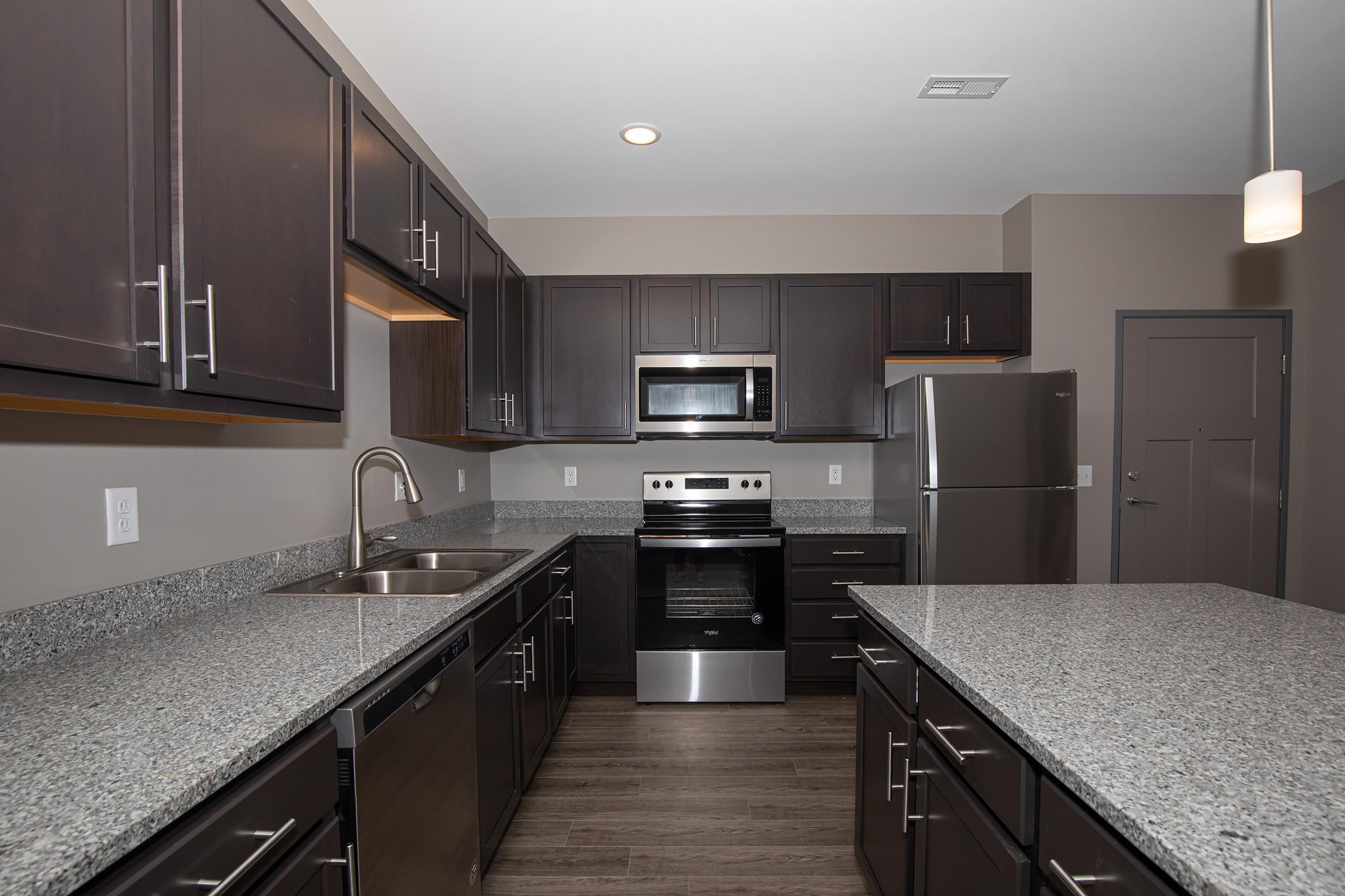 a modern kitchen with stainless steel appliances