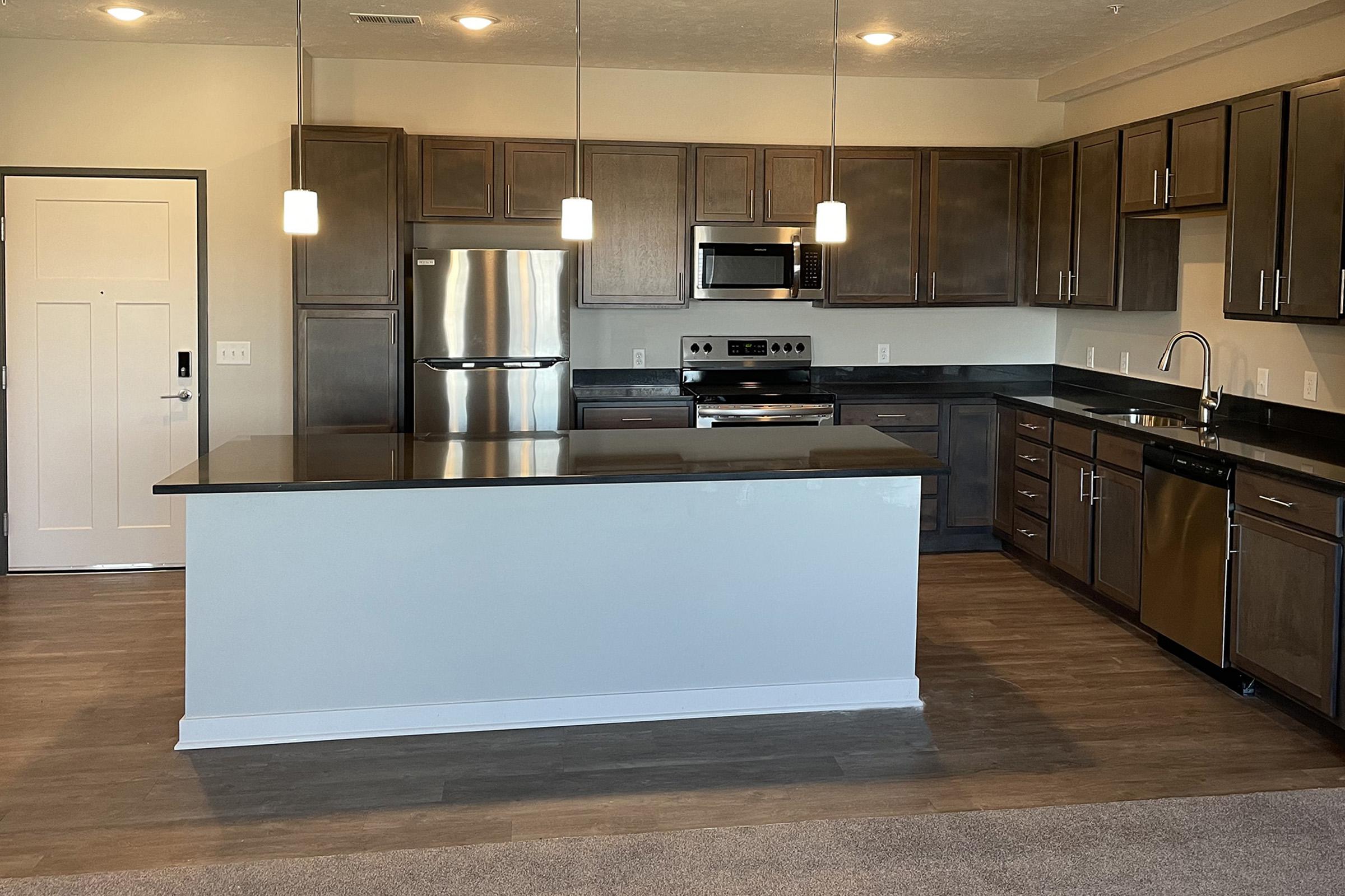 a modern kitchen with stainless steel appliances