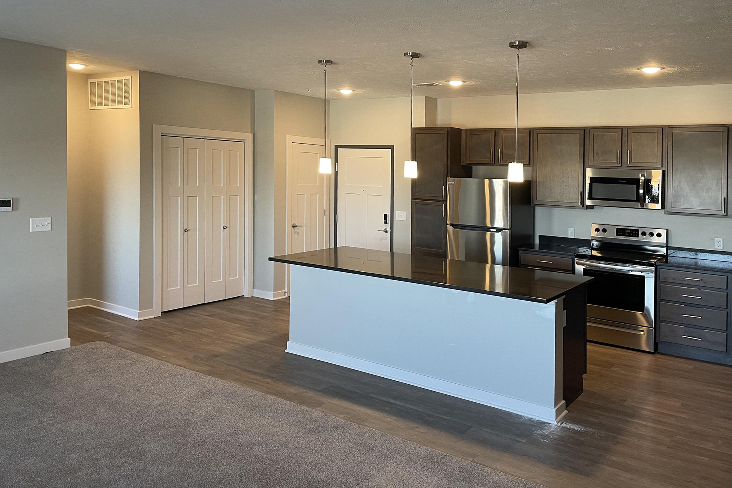 a large kitchen with stainless steel appliances