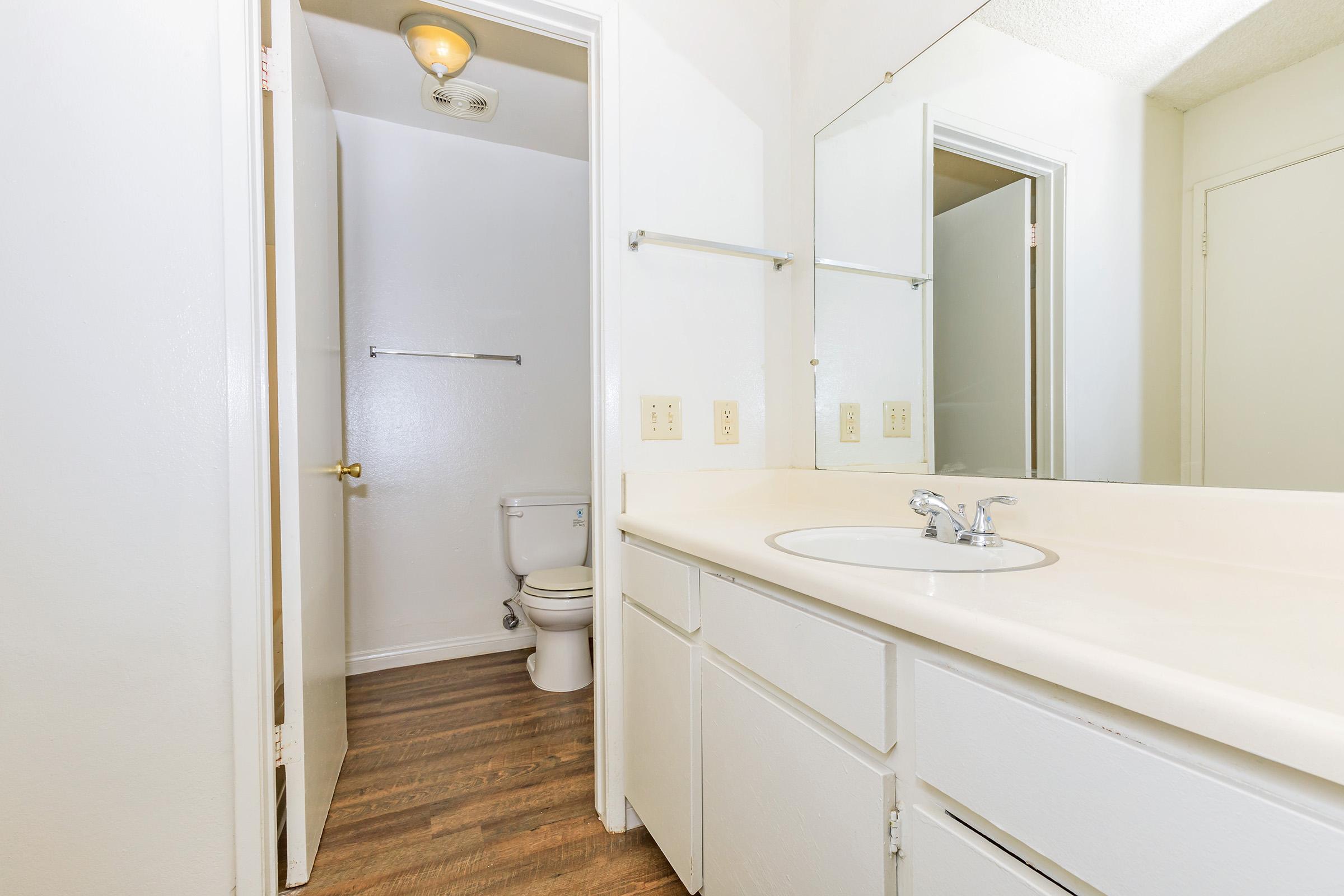 a room with a sink and a mirror